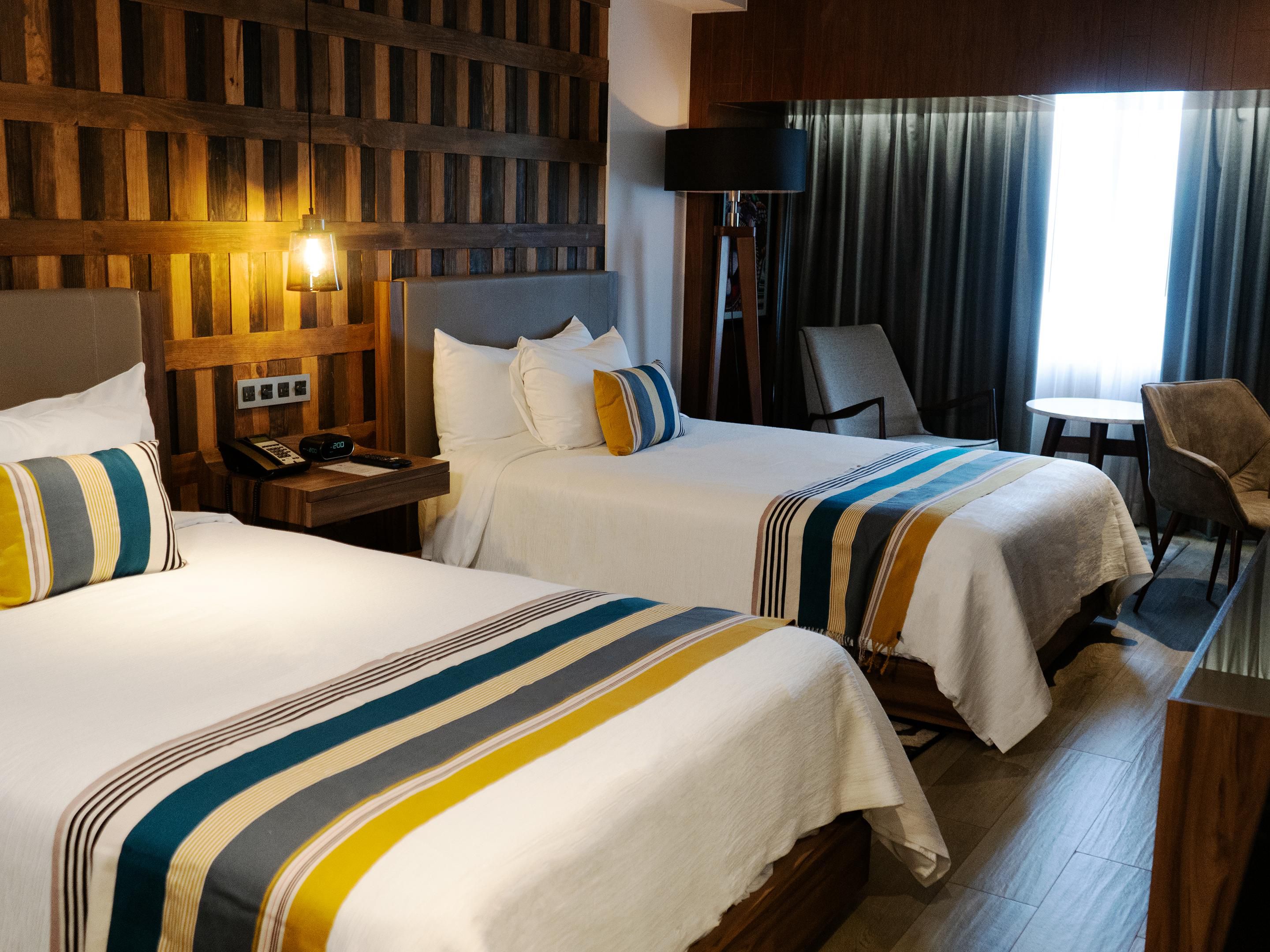 Our spacious rooms feature lounge seating and workspaces.