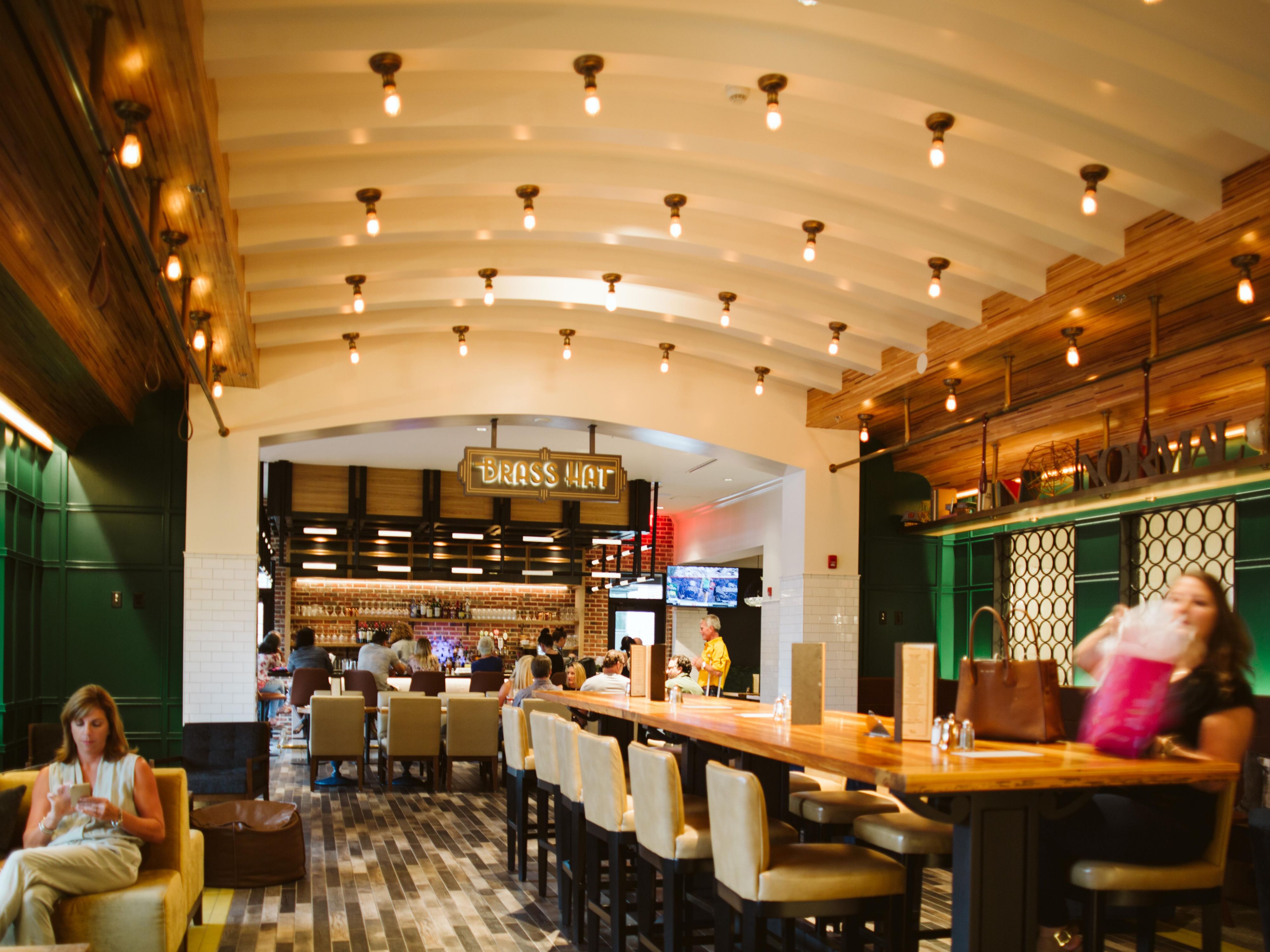 Located within Hotel Indigo, Brass Hat features chef-driven small plates, handcrafted cocktails, and a well-curated wine list, all in a modern setting that pays homage to the city's distinctive railroad heritage. Locals & guests can come together to eat, drink, and enjoy the vibrancy and uniqueness of the local neighborhood. 