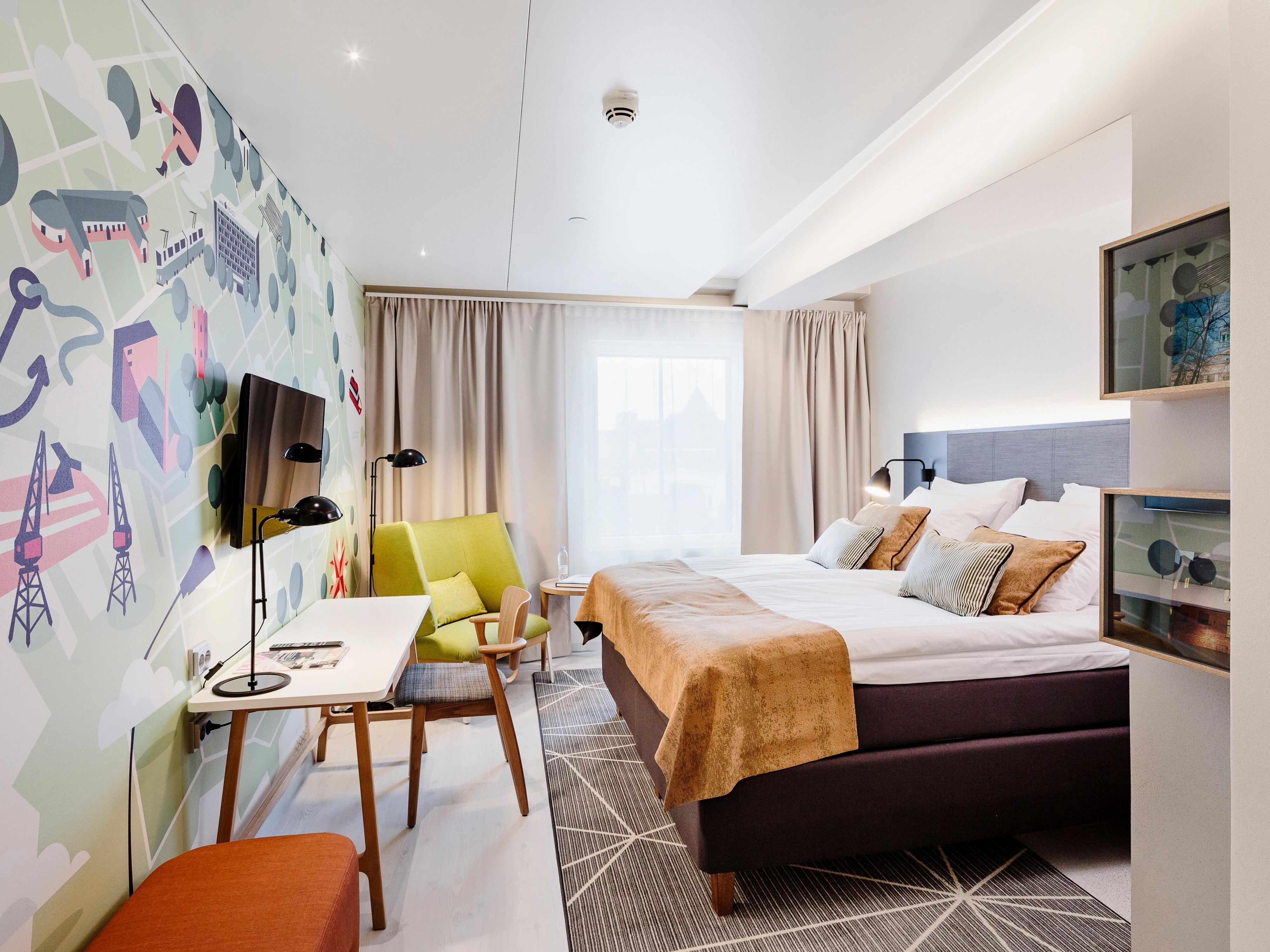 Standard room with Queen Bed and mural by Pietari Posti