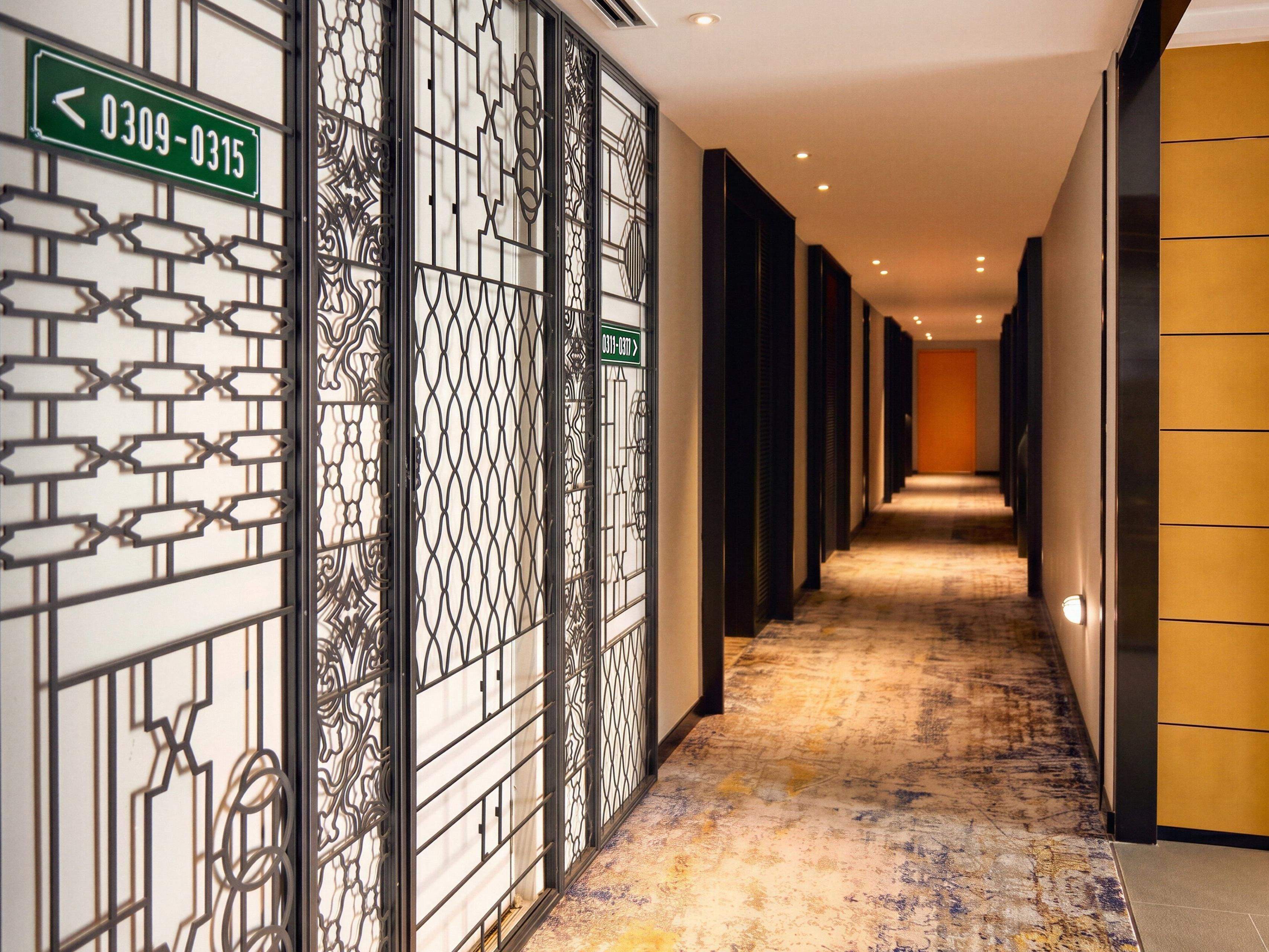The hotel's hallways reimagine a stroll past Saigon's houses.
