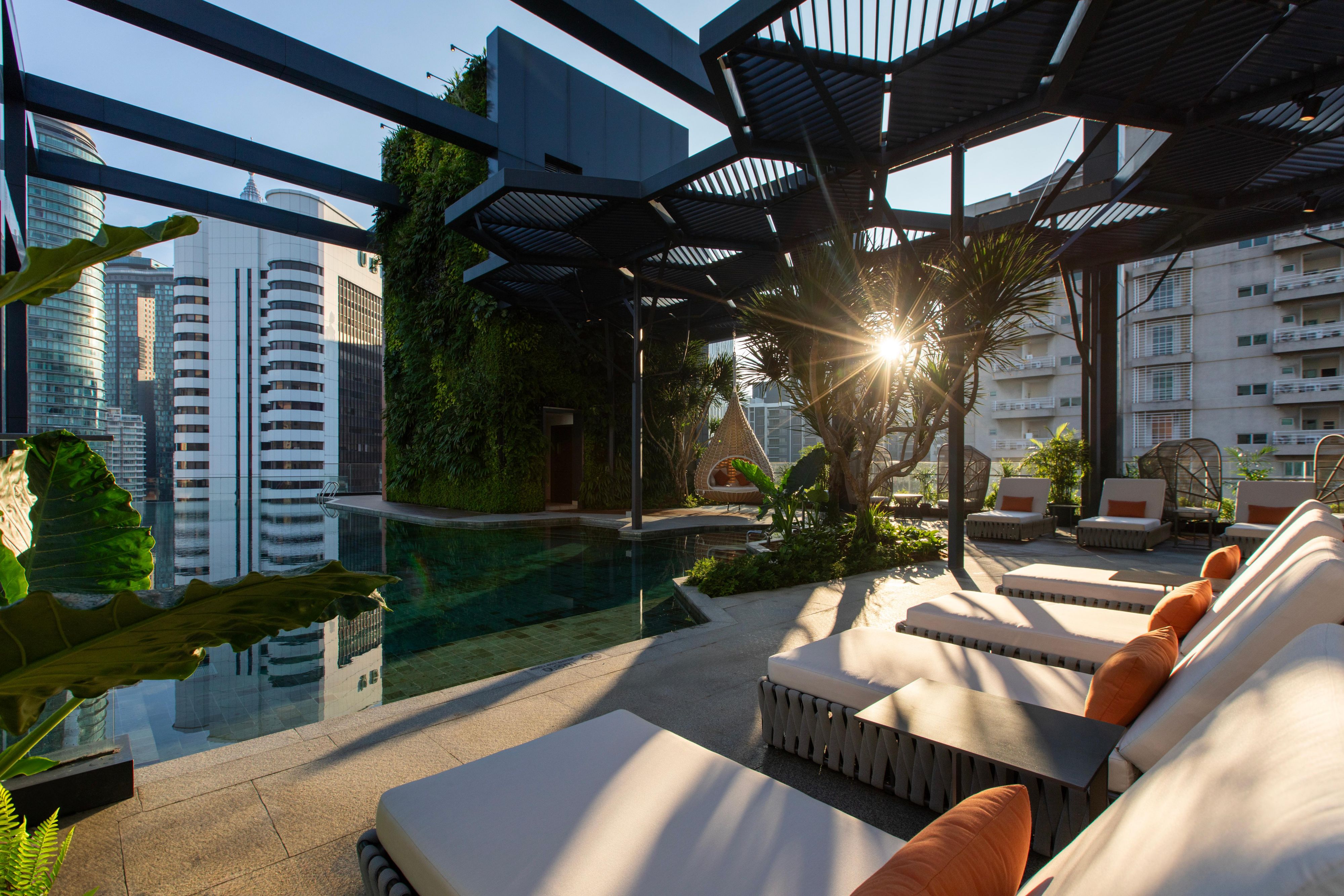Hotel Indigo in Kuala Lumpur's Golden Triangle, near Bukit Nanas and KL Forest Eco Park, melds urban vibrancy with nature. Close to KLCC and culinary streets like Jalan Alor, it offers eco-friendly luxury with stunning views of the KL Tower and Merdeka 118, perfect for exploring the city's heart.