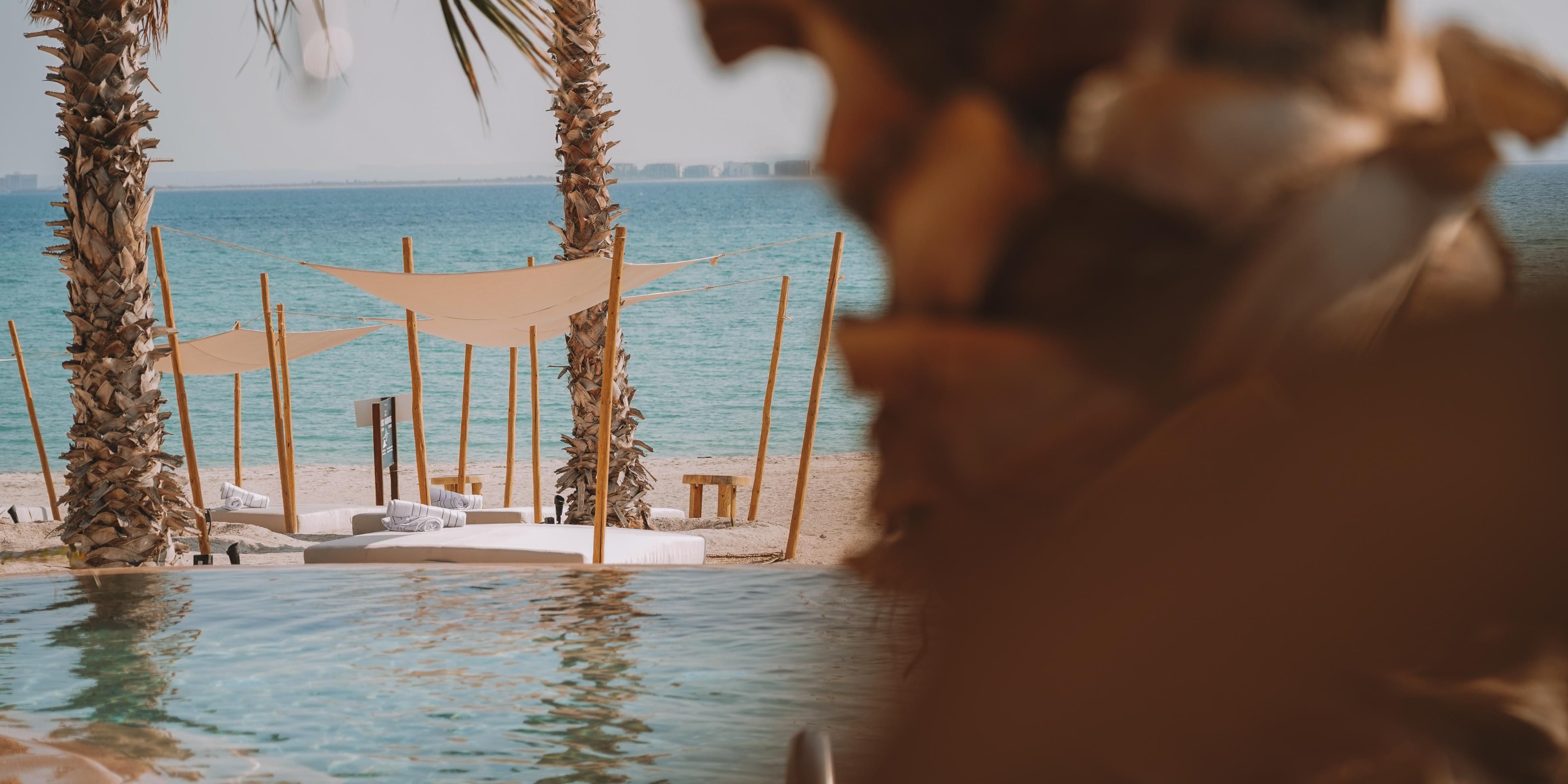 Take a dip in our pool or relax in our lush outdoor cabanas.