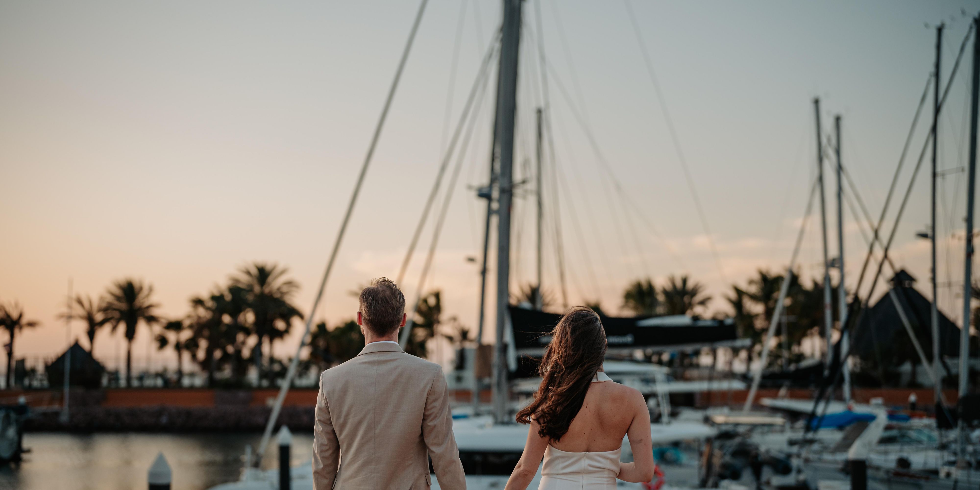 Couple by the boats at suntet
