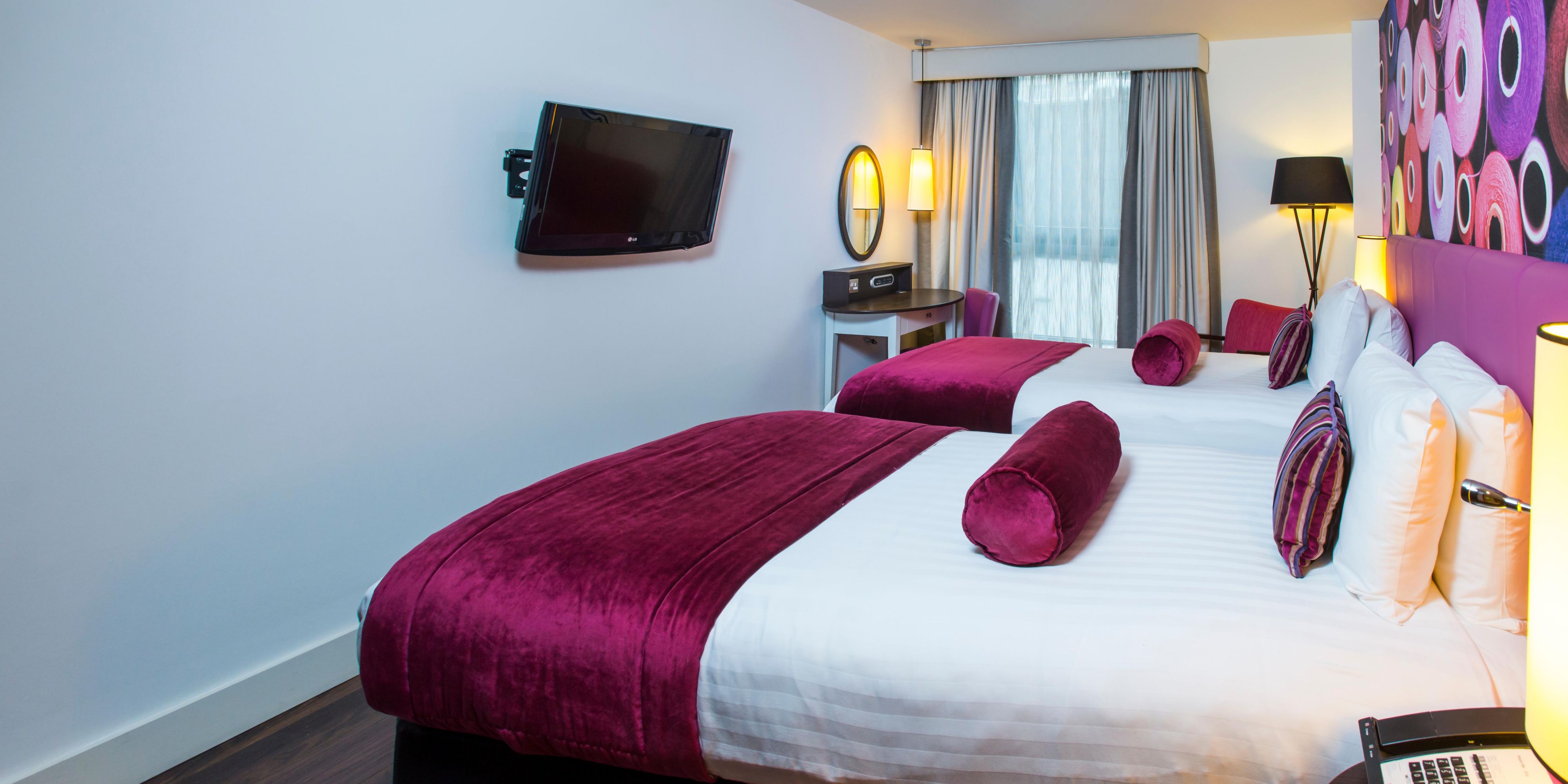 Twin bed room with selection of complimentary snackbar items
