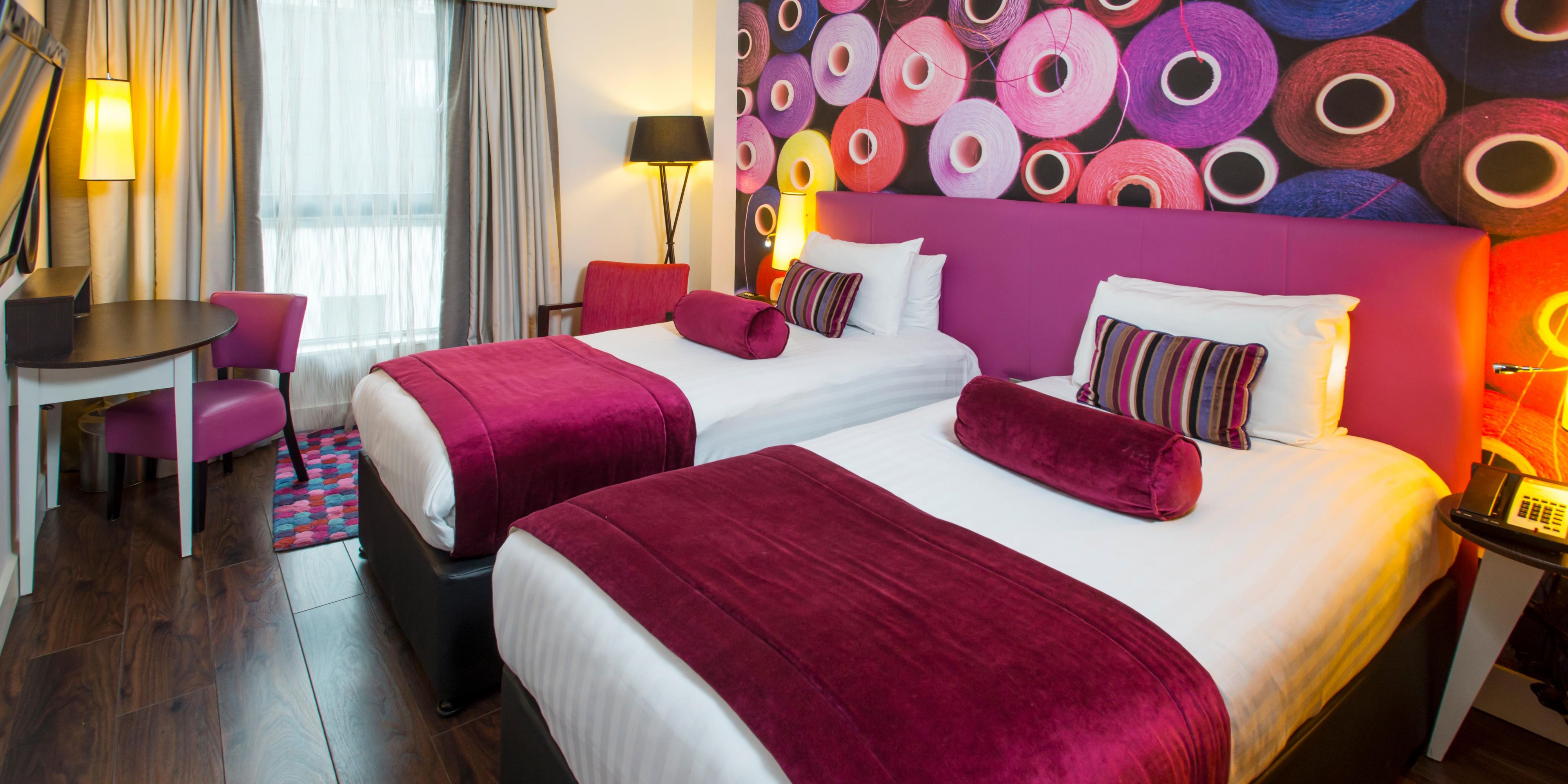 Twin bed room with selection of complimentary snackbar items
