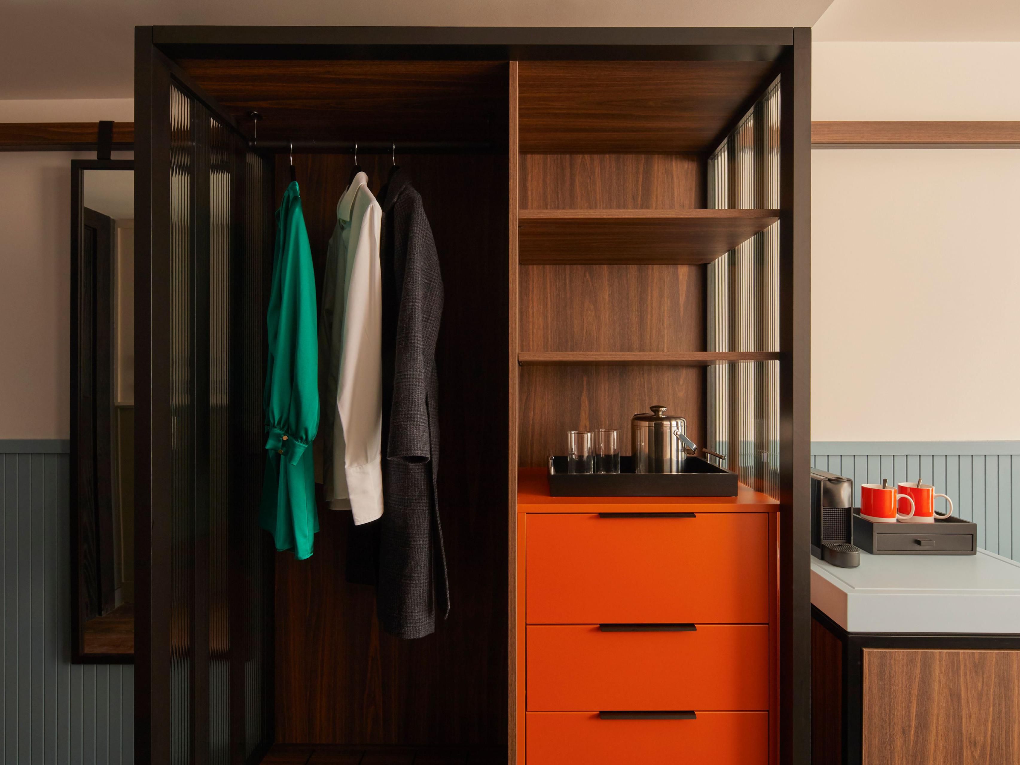 Architect room wardrobe with drawers and hangers.
