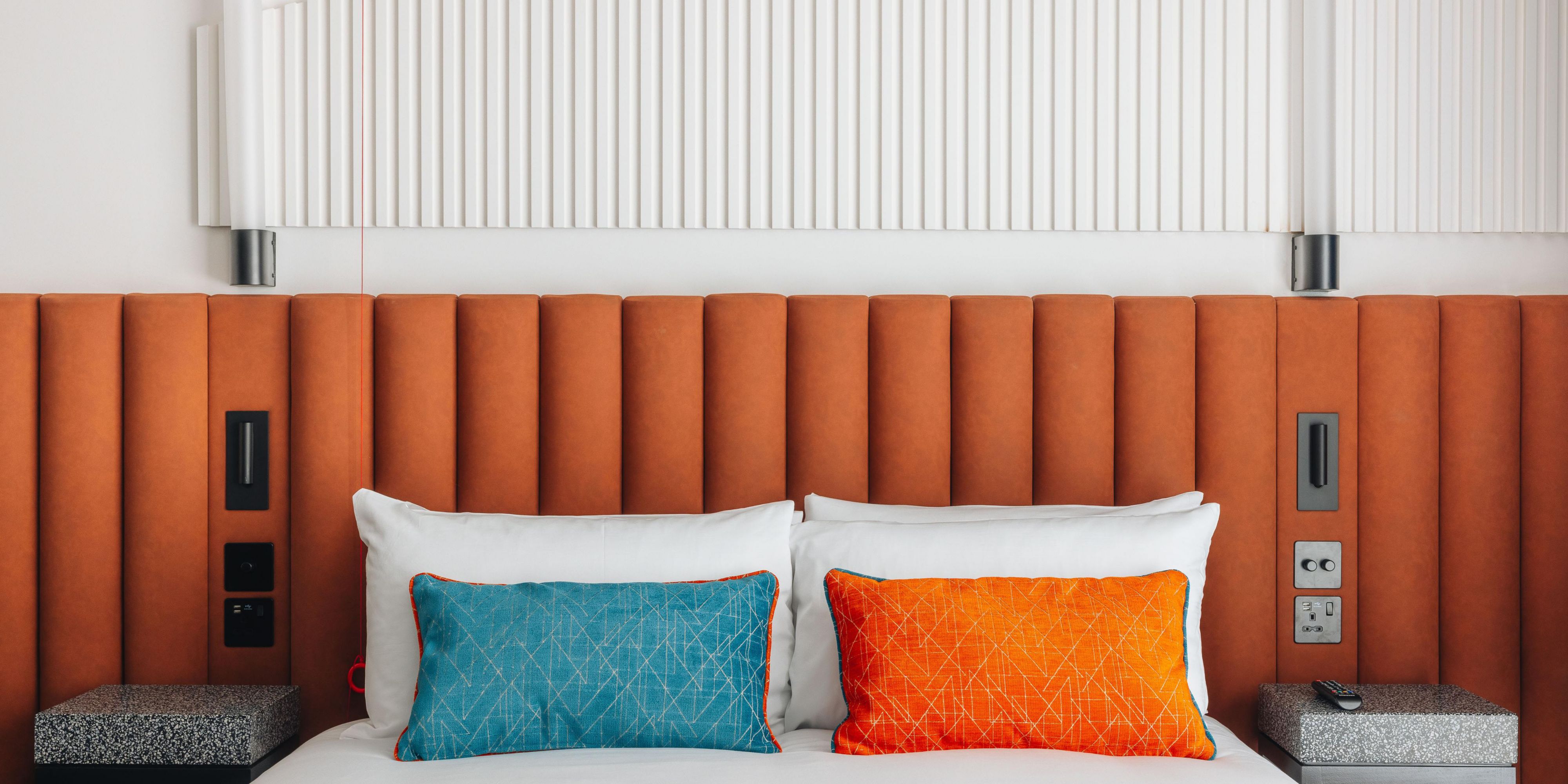 Queen bed with accessibility features.