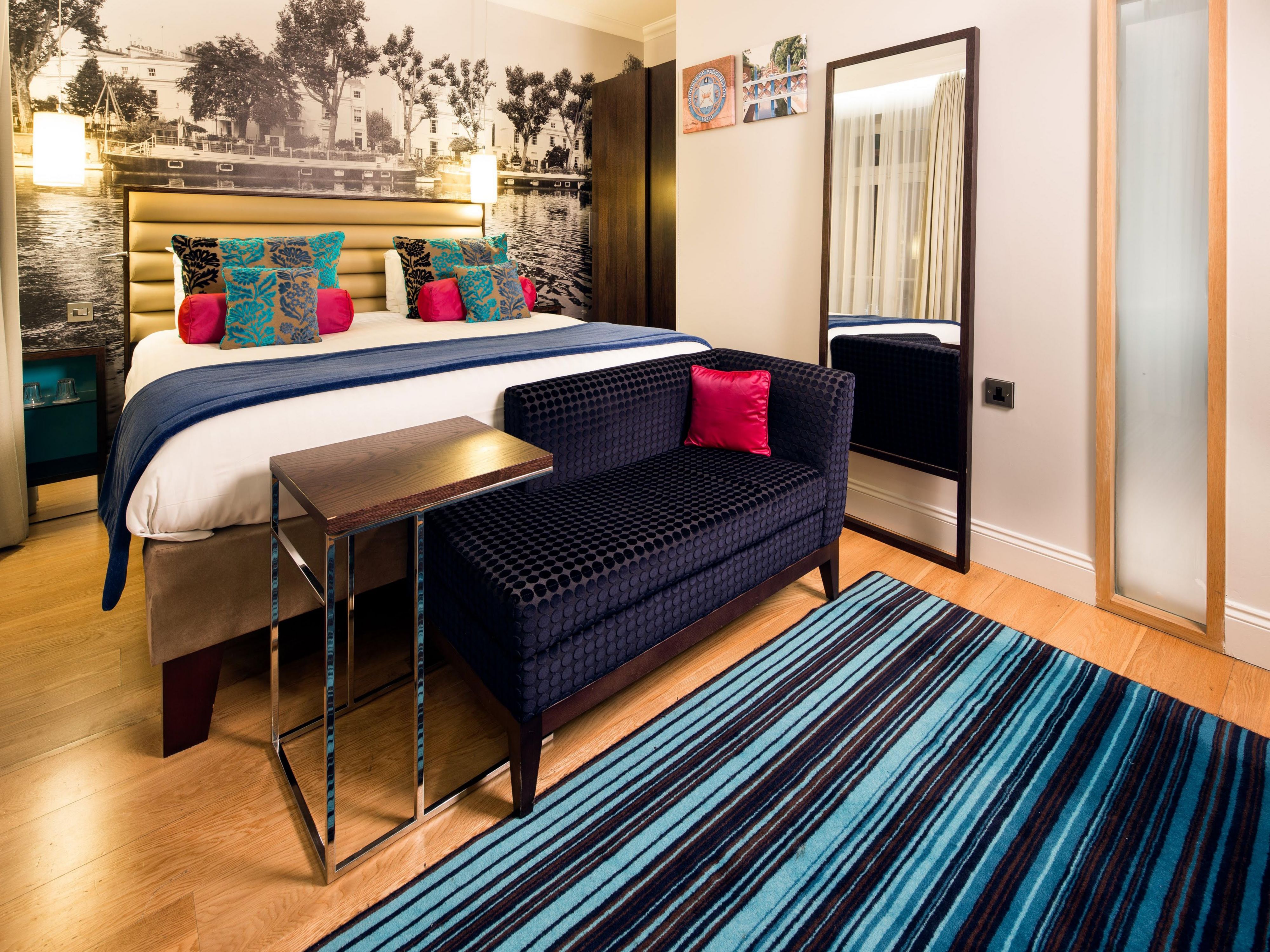 Premium room with blue colour scheme and Little Venice artwork
