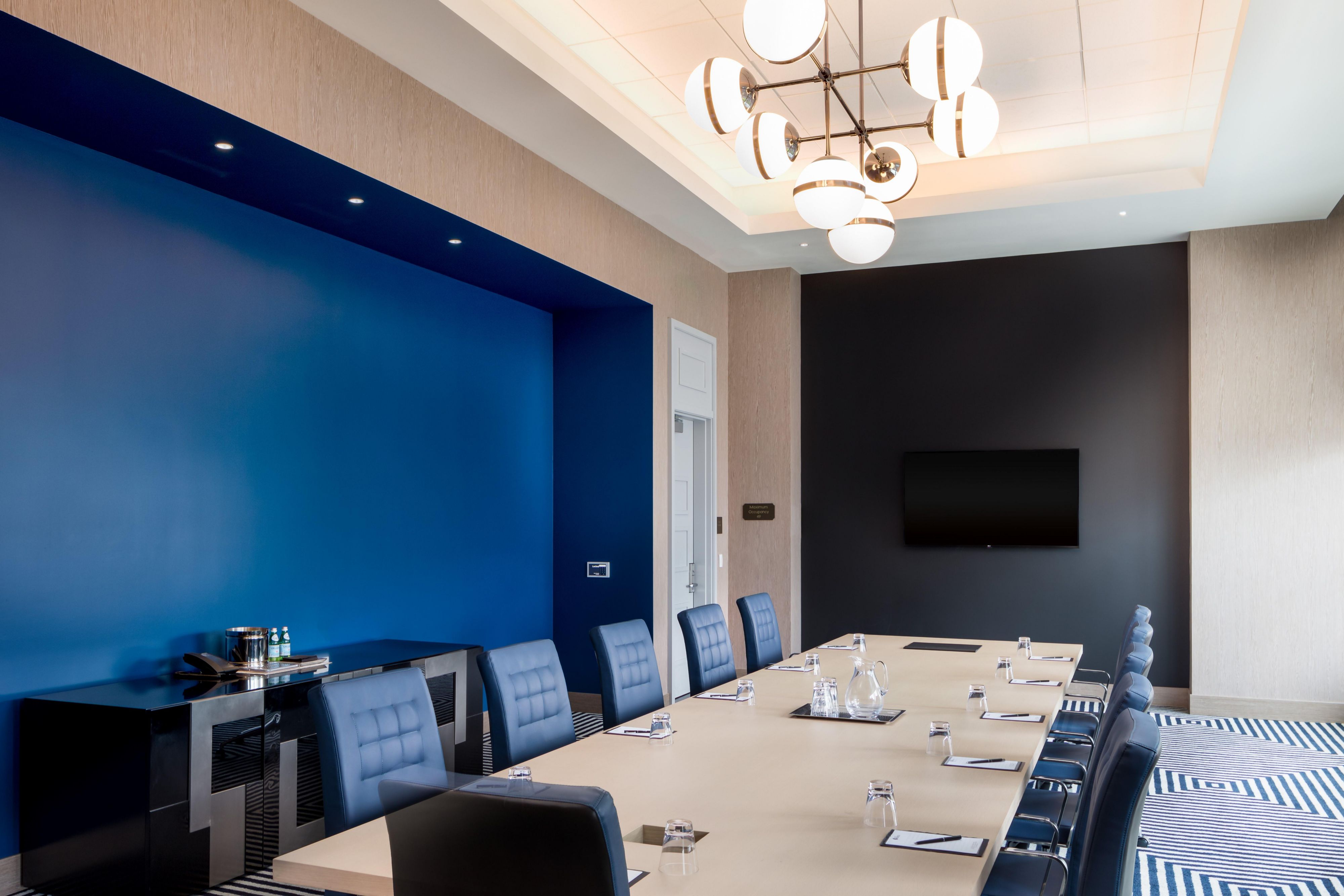 Empire board room with long table that accommodates up to 12 guests