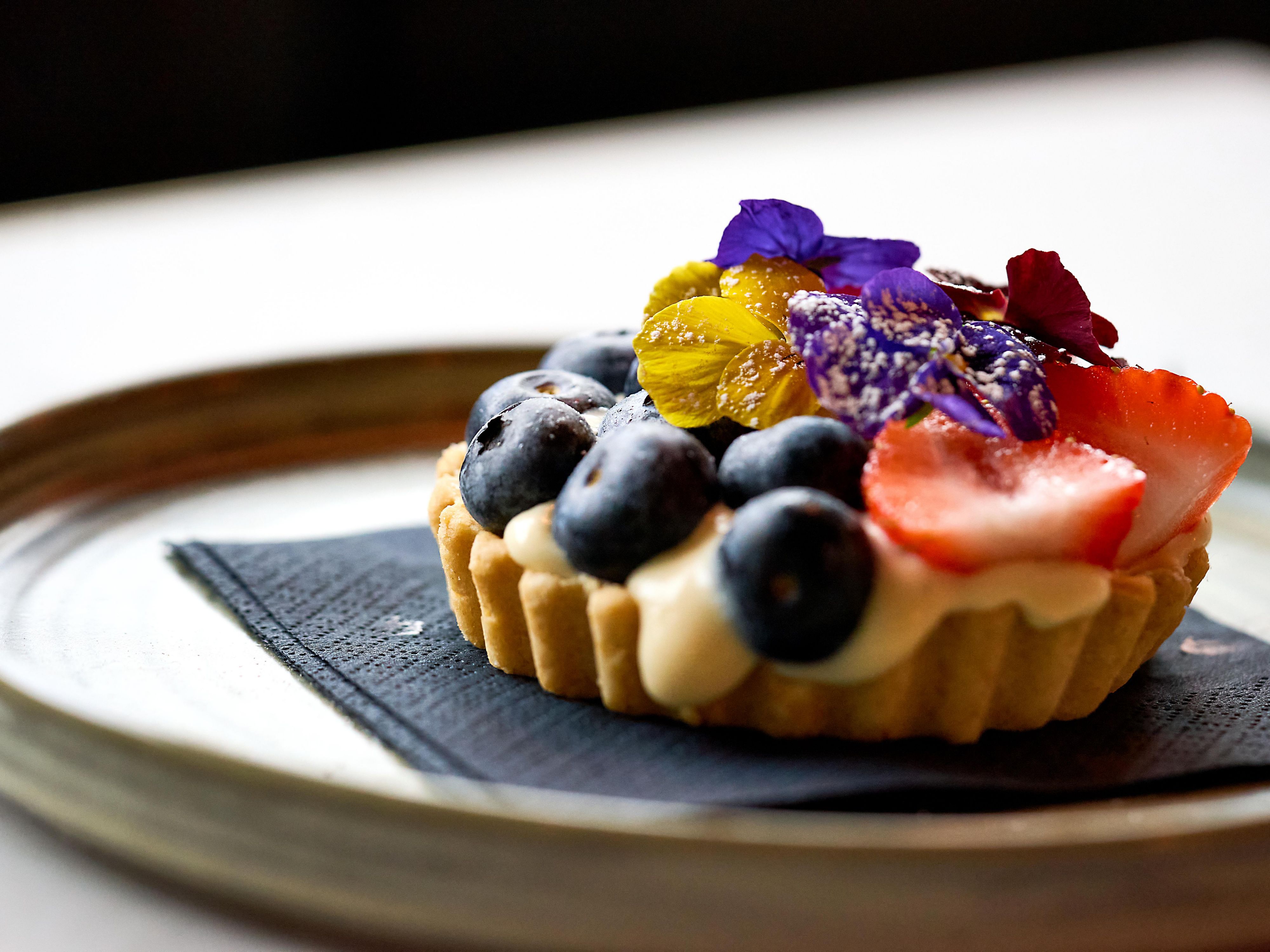 Chocolate ganache and vanilla tart garnished with berries