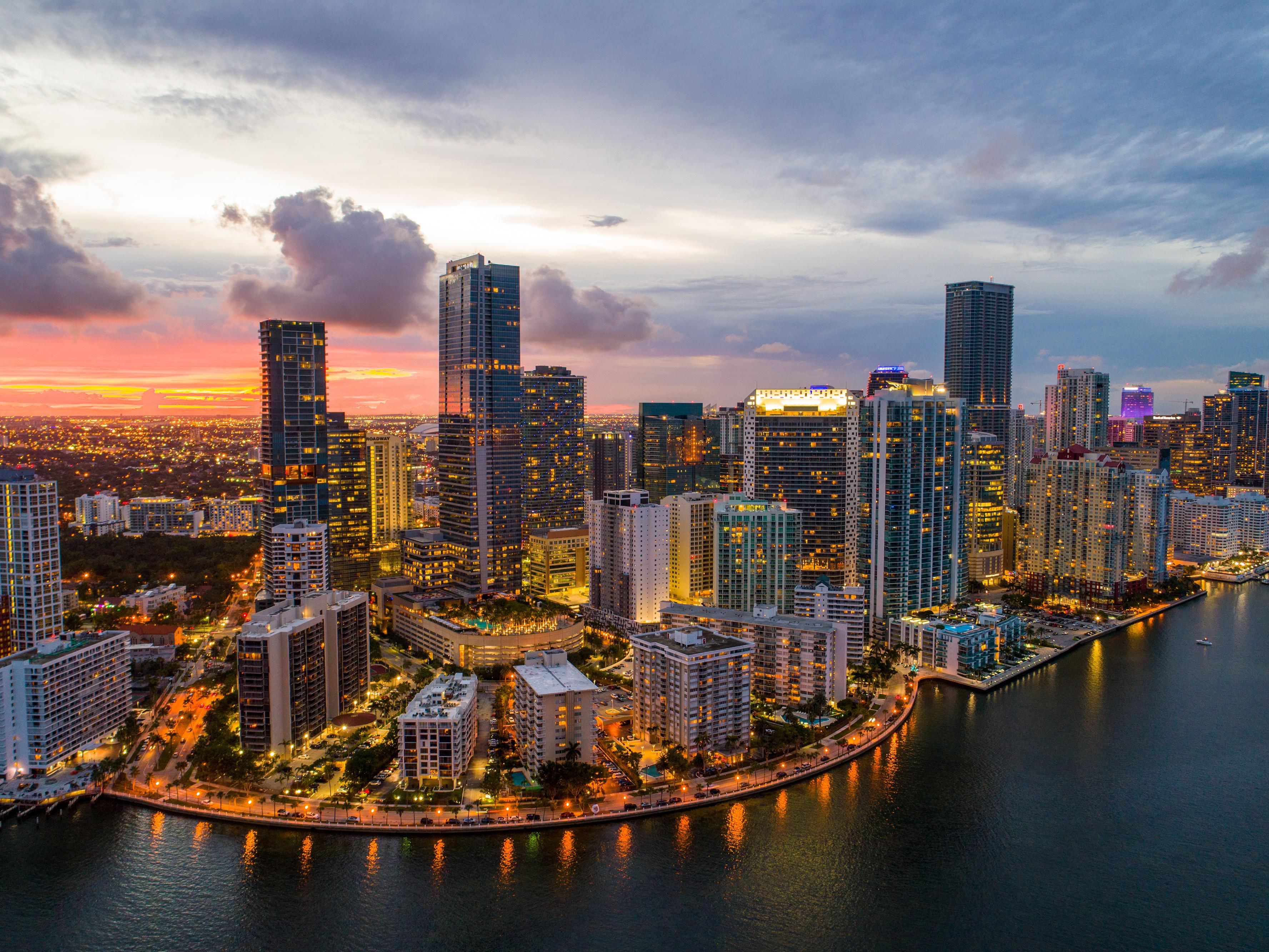 Downtown Miami skyline reflecting on the water at twilight