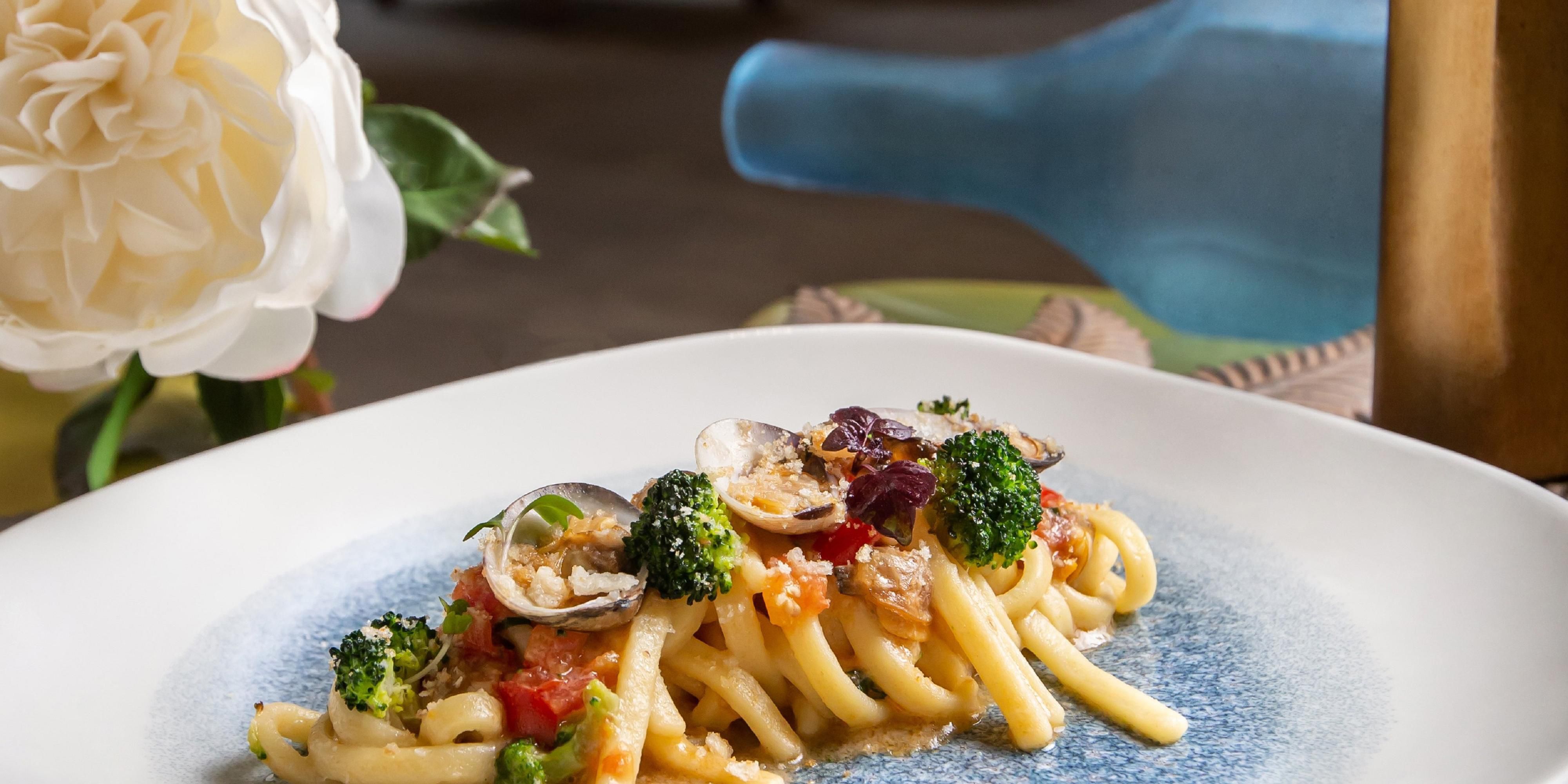 Fresh pasta with seasonal vegetables and clams