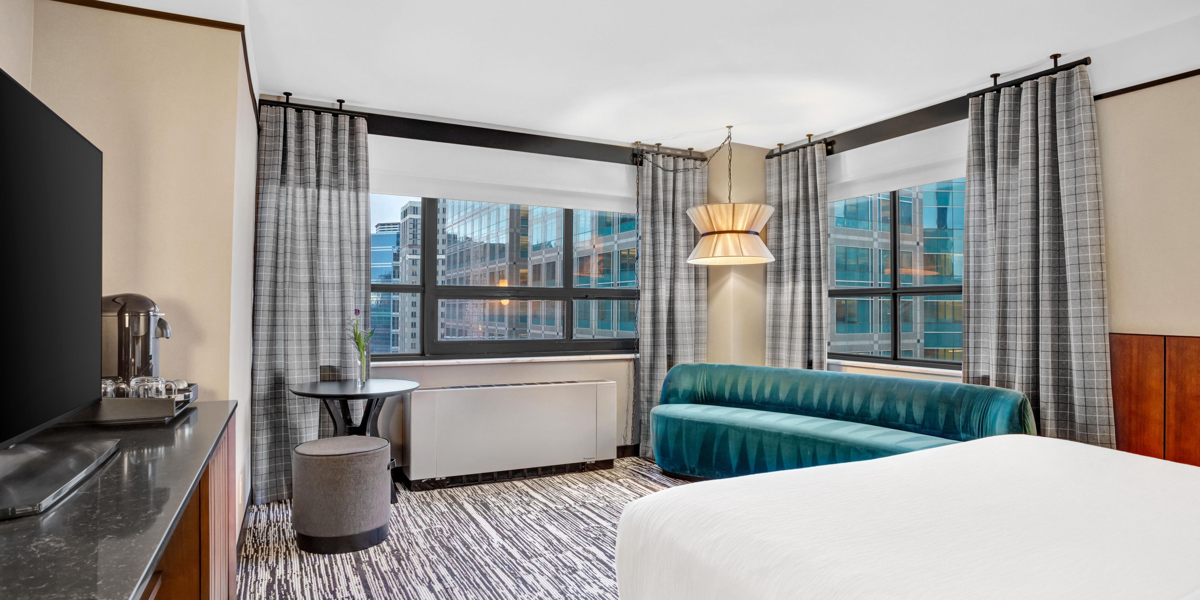 City lights and skyline sights from your premium corner room.
