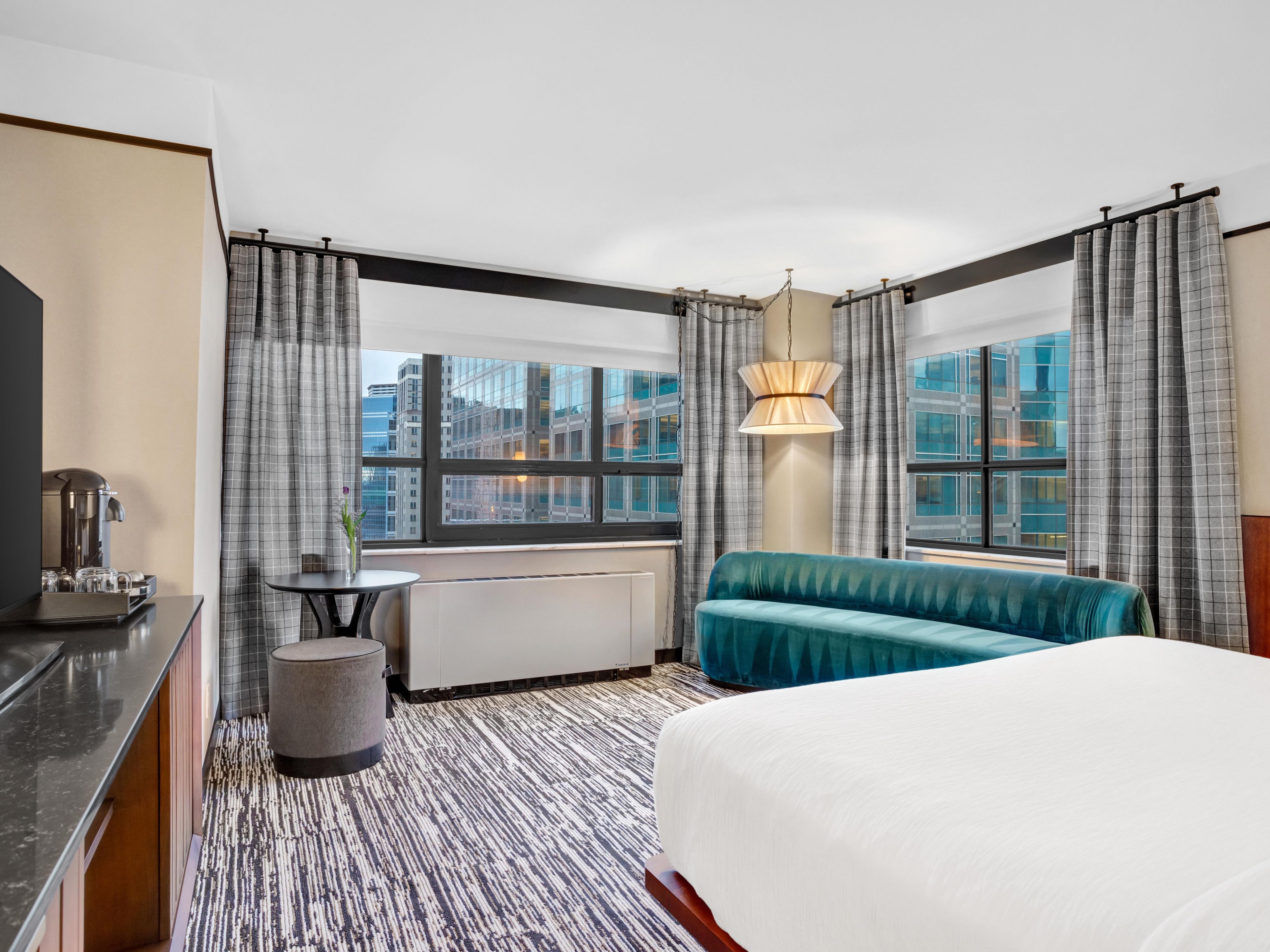 City lights and skyline sights from your premium corner room.