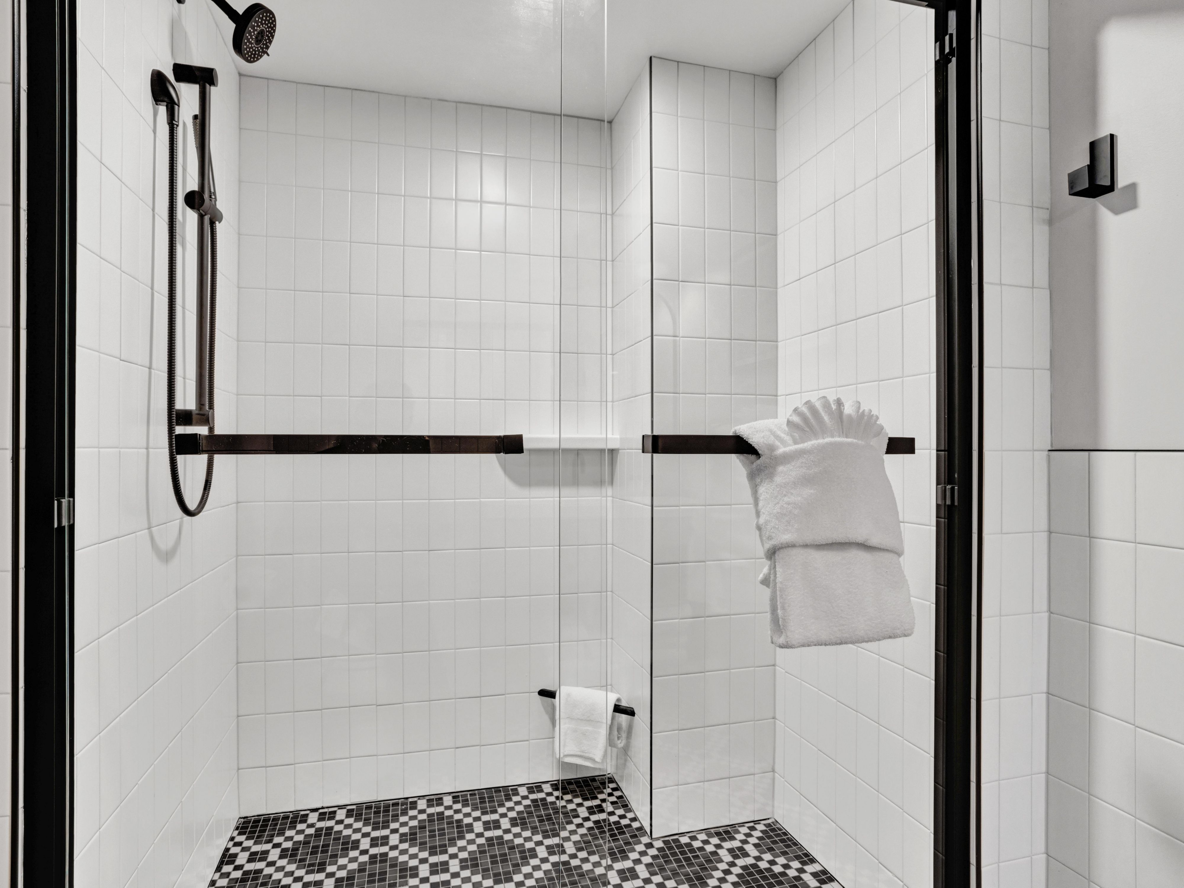 Bold tilework and a built-in footrest for easy comfort.