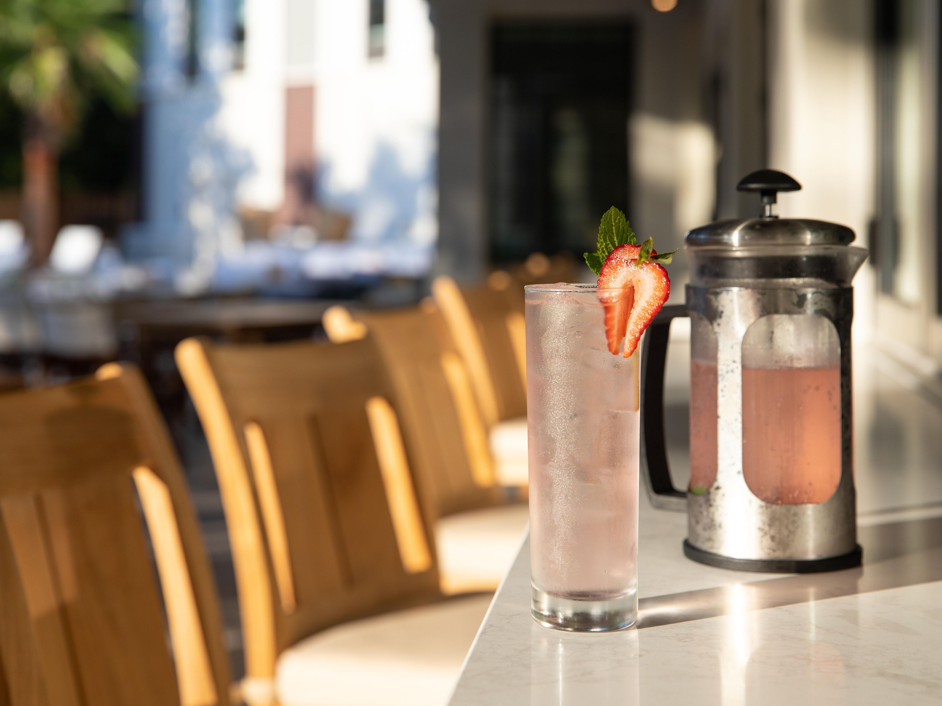 outdoor bar with cocktail pitcher and glass
