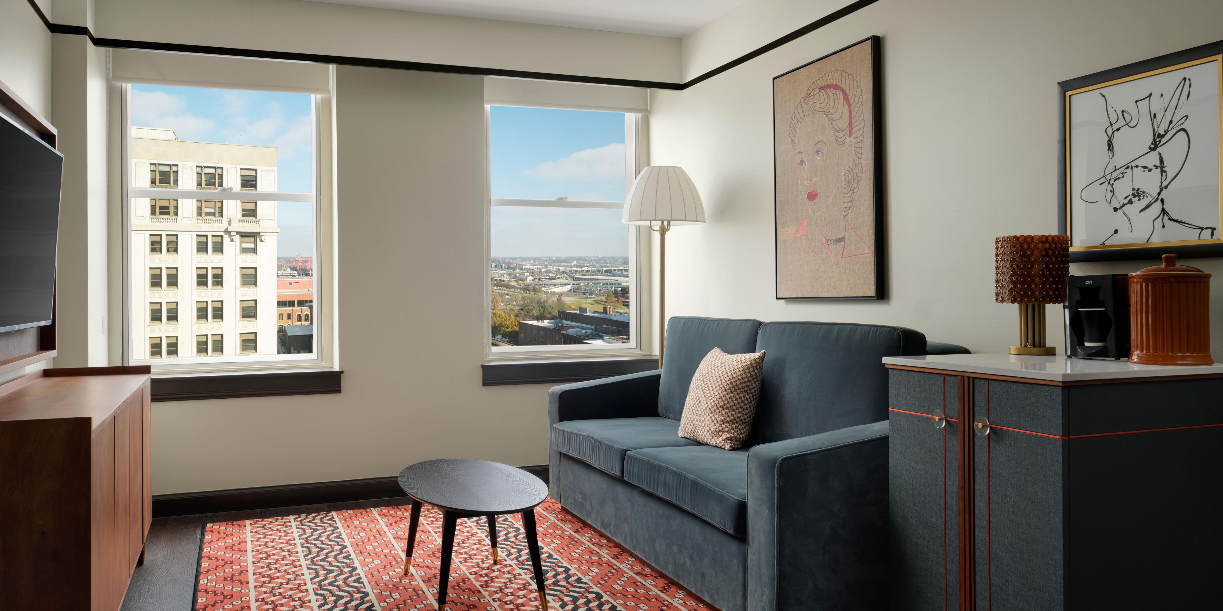 Living Area with Sleeper Sofa, City View, and Mini-Fridge