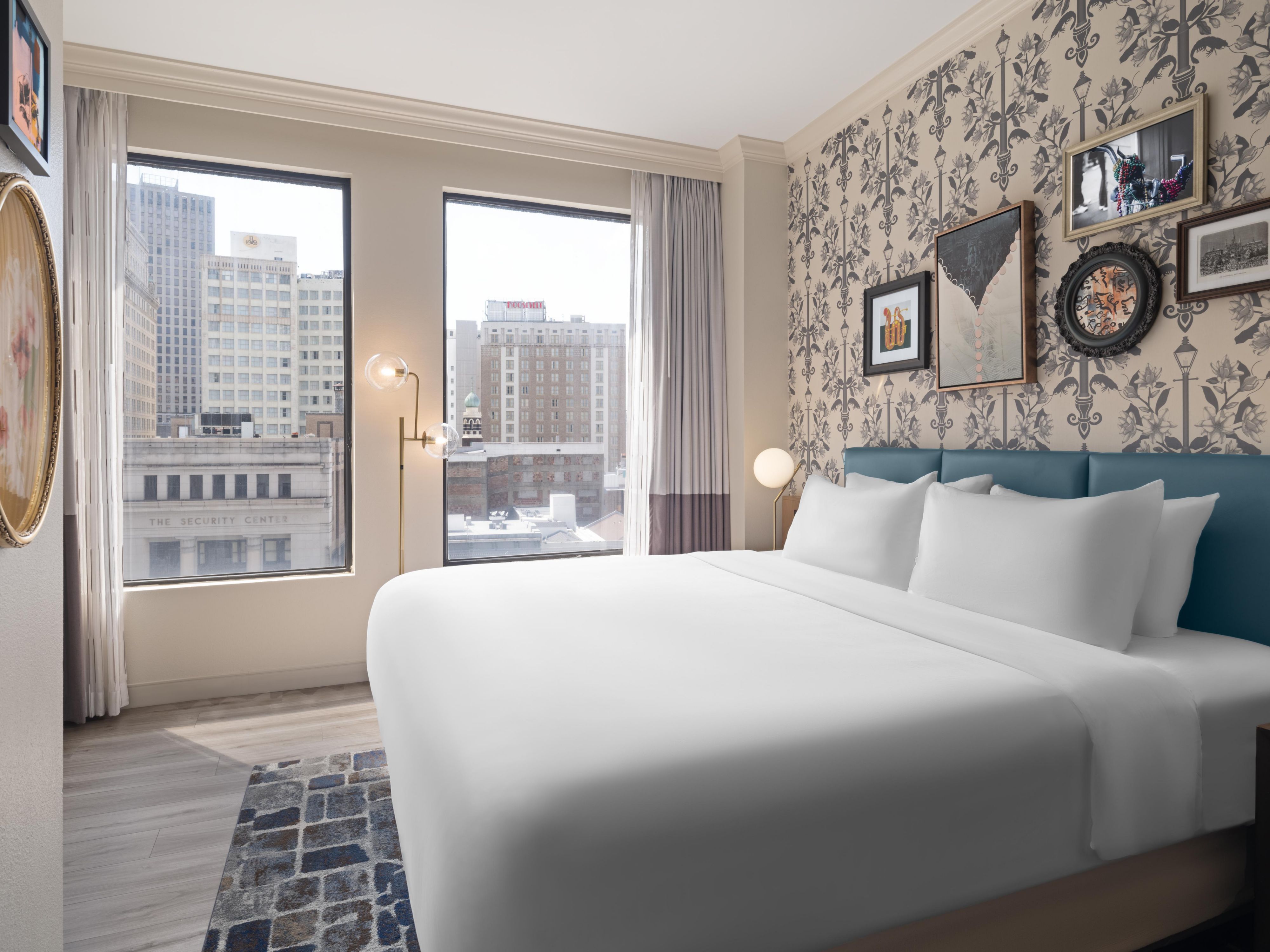Wake up to stunning city views from our chic guestrooms.