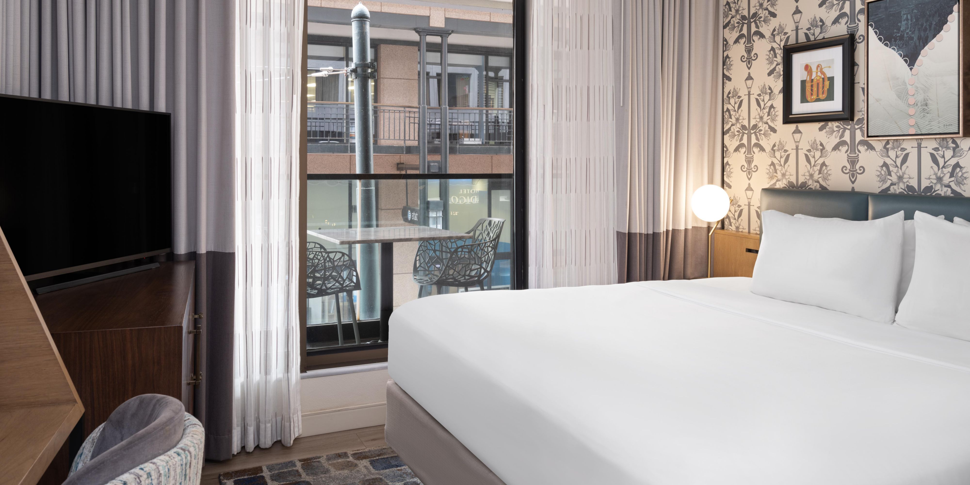 Enjoy city views from our king balcony room.
