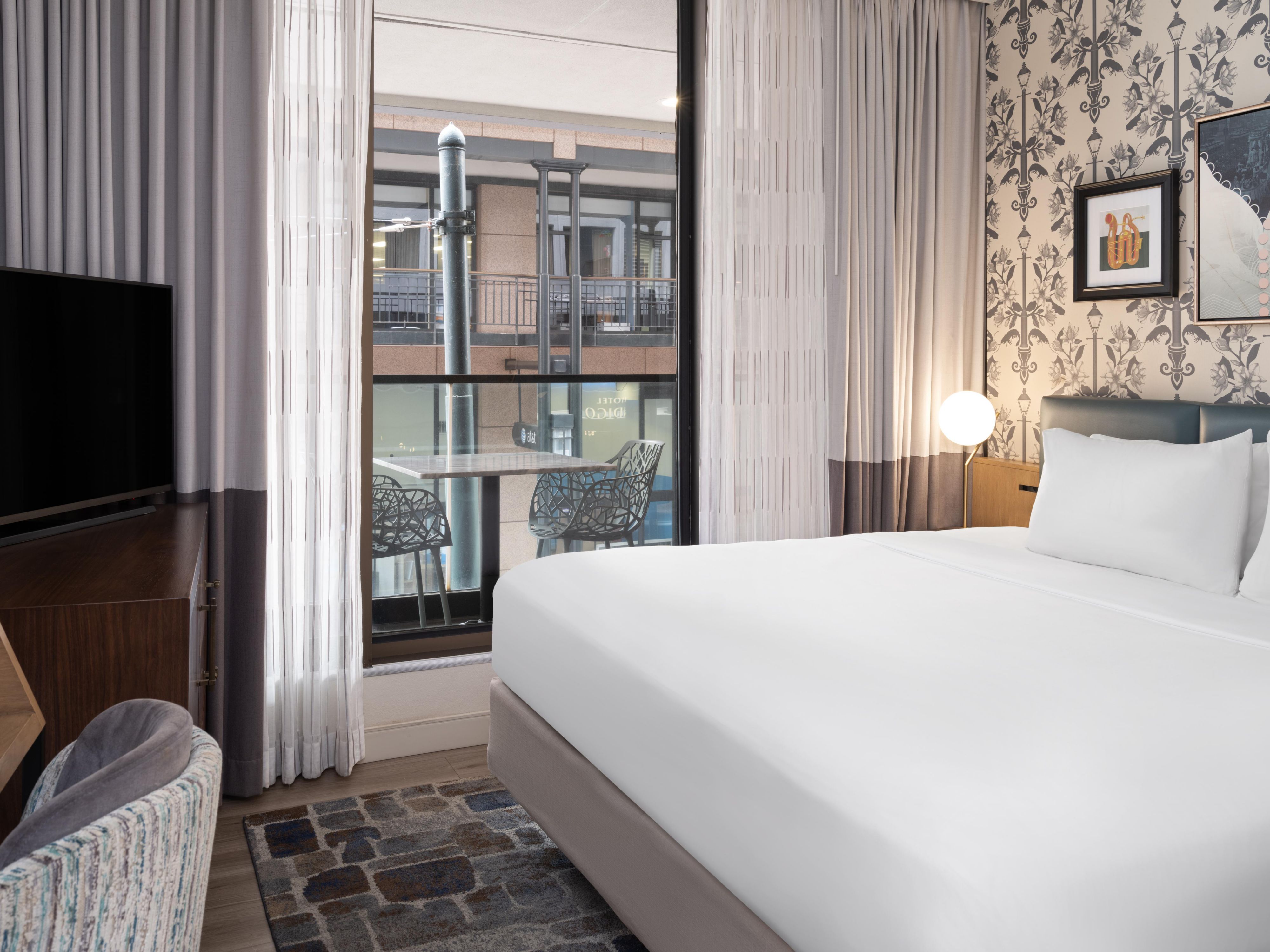 Enjoy city views from our king balcony room.