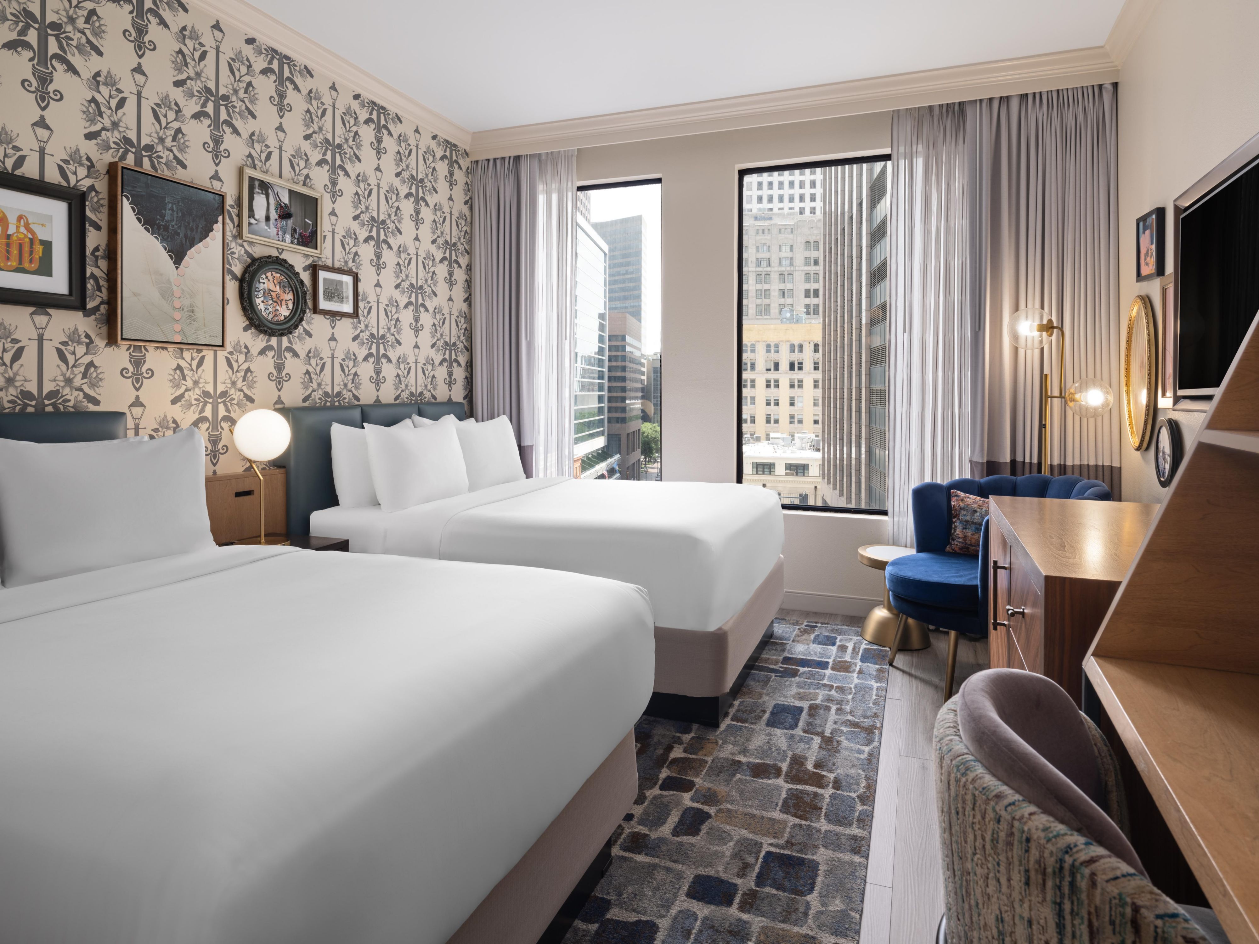 Rest and recharge in our inviting two-bedded room at Hotel Indigo.