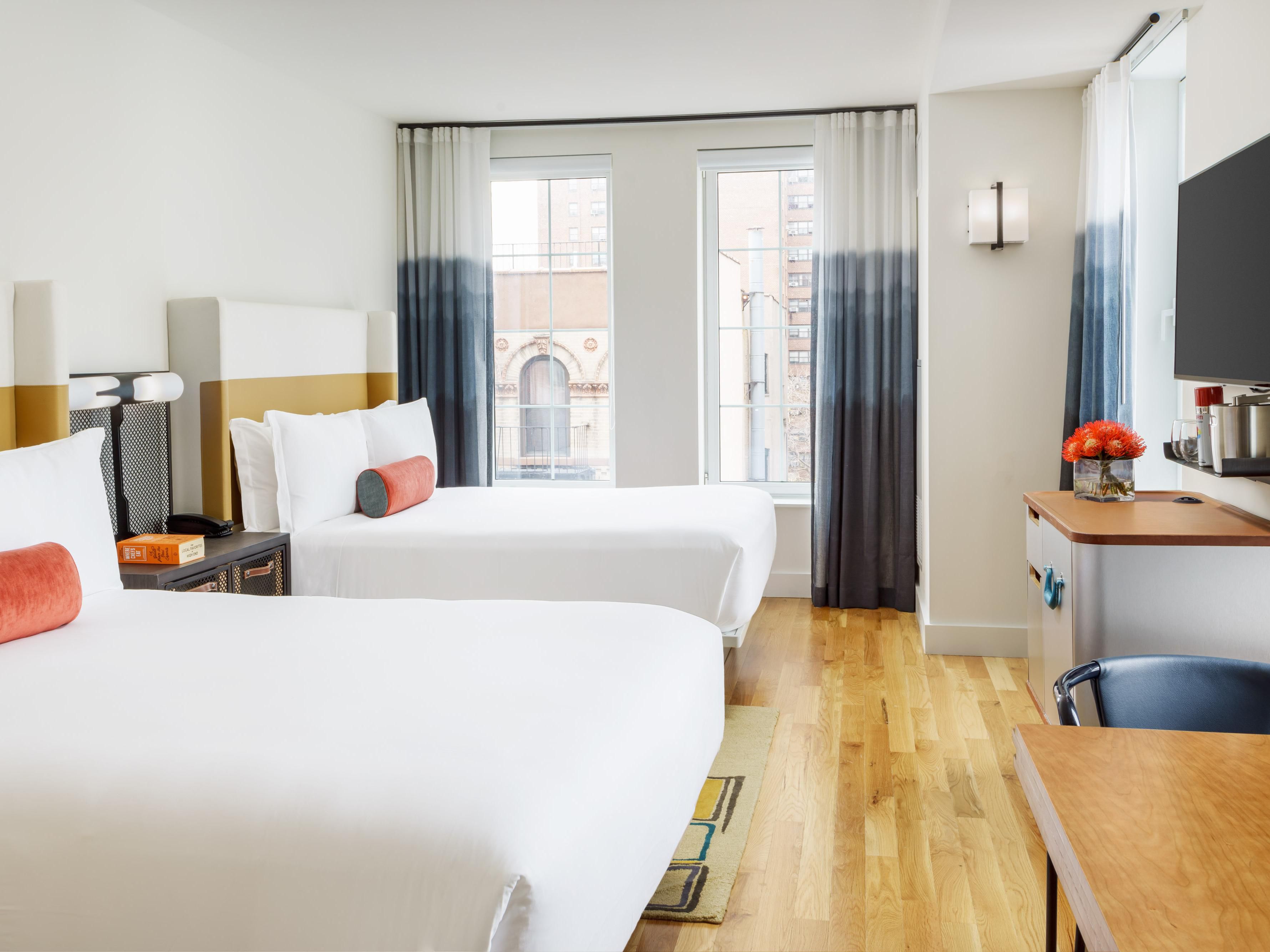 Relax with your family in our deluxe two queen bed guest room