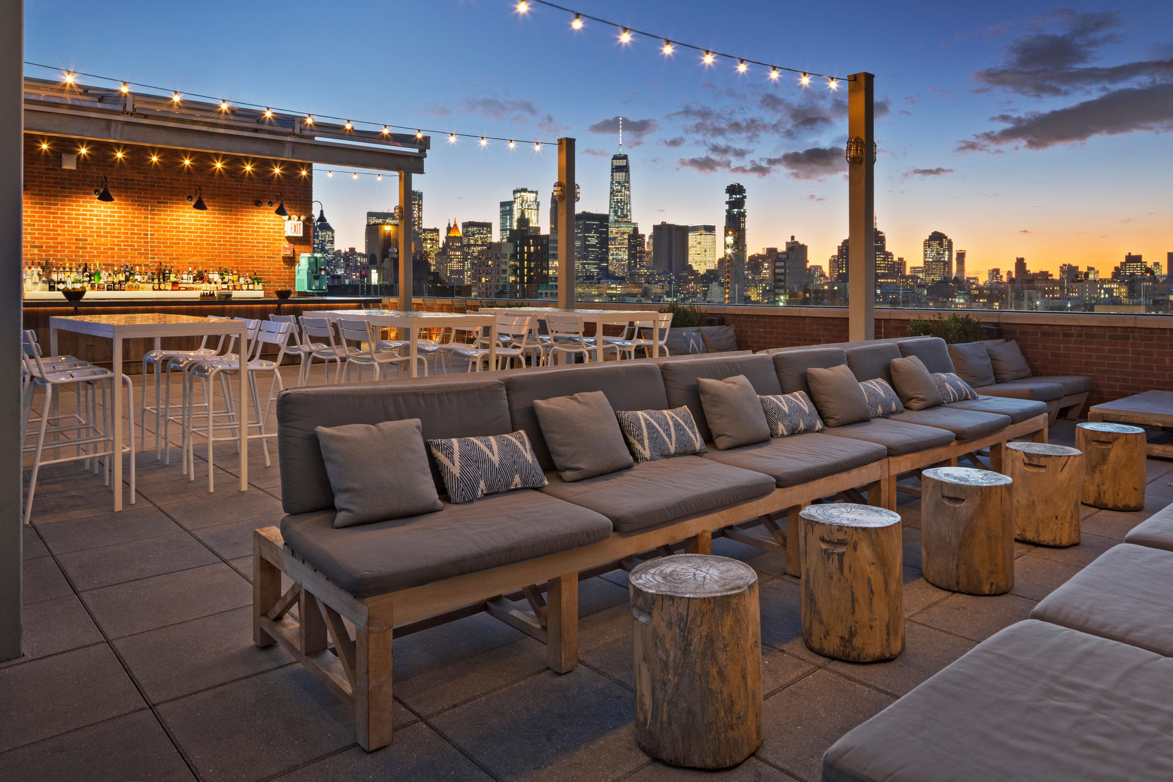 Elevate your mood at Mr. Purple, our hip rooftop bar and restaurant overlooking NYC’s Lower East Side. Located on the hotel’s 15th floor, our rooftop bar captures the vibrant and creative spirit of the LES with an artist-loft ambiance and flowing indoor and outdoor spaces. Enjoy cocktails and light fare with views of Manhattan’s neighborhood.
