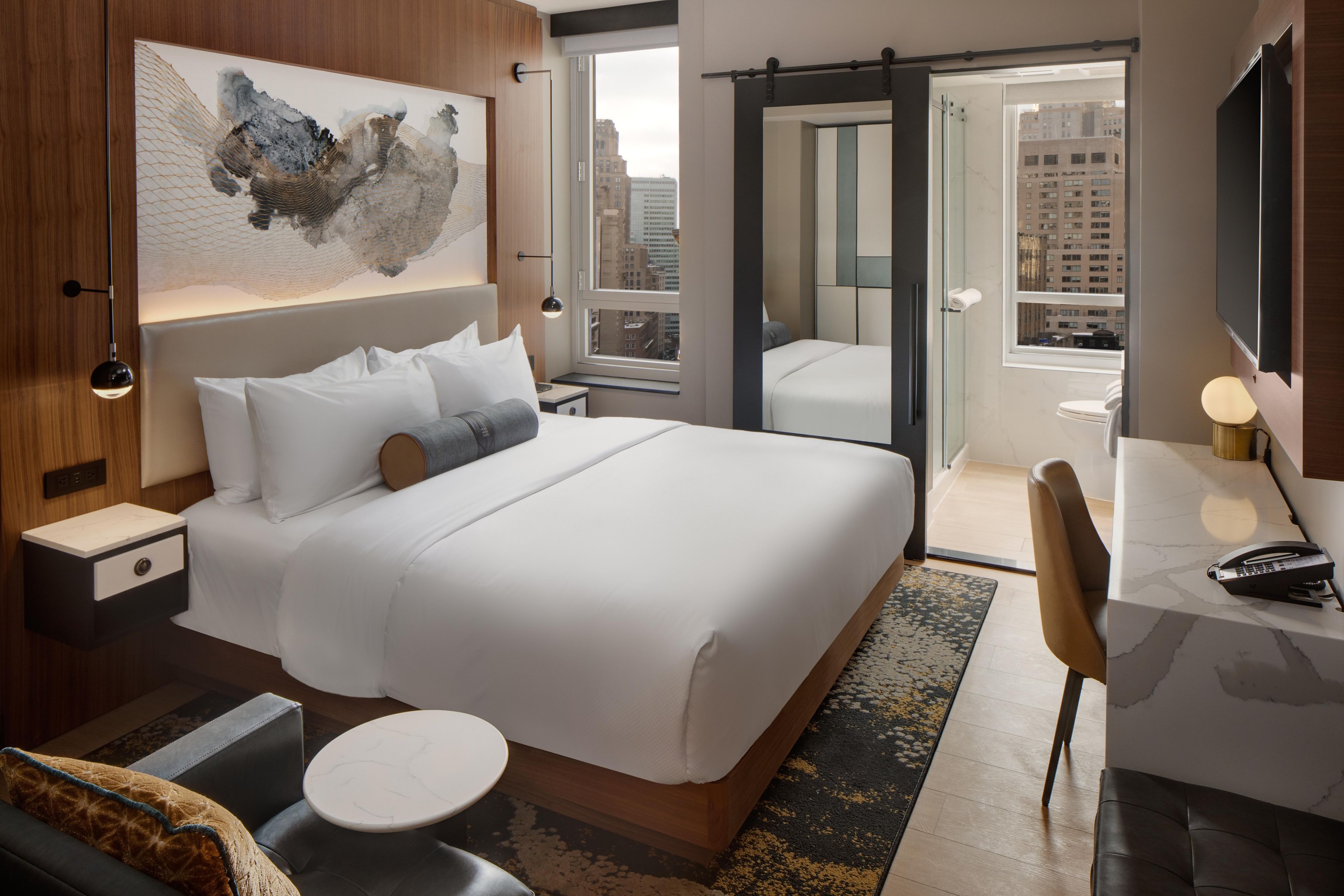 Our 127 boutique guest rooms offer a respite from the pace of the Financial District. Designed as an ode to our neighborhood’s historic days, our rooms offer a modern retreat for work and rest. Enjoy rooms with spa-like bathrooms and upgrade to guestrooms with balconies with views of downtown NYC.