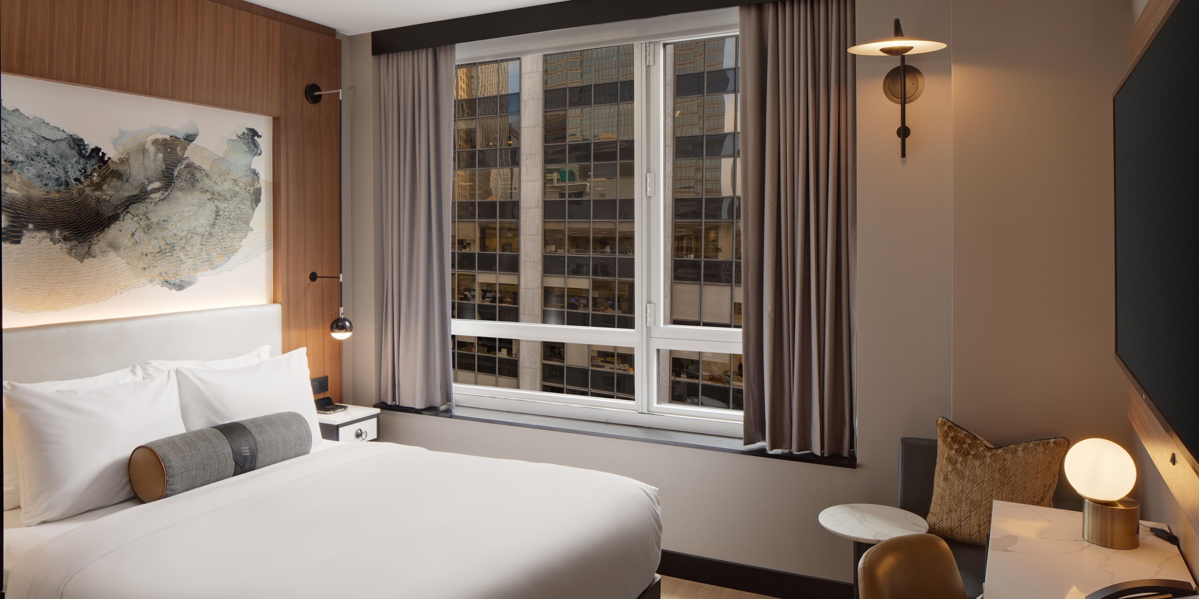 Enjoy a cozy stay with a marble desk and a leather chair