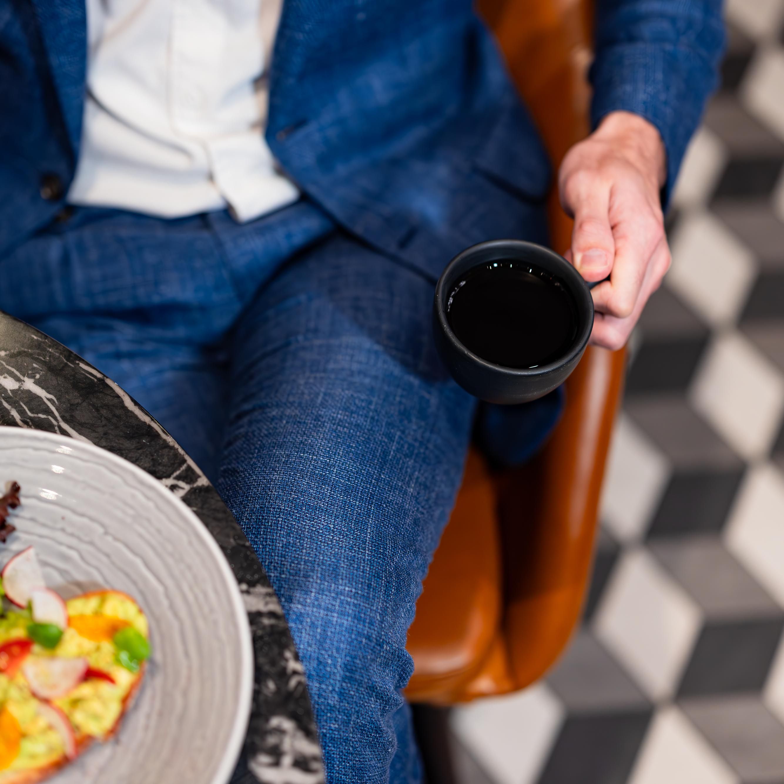 man holding coffee