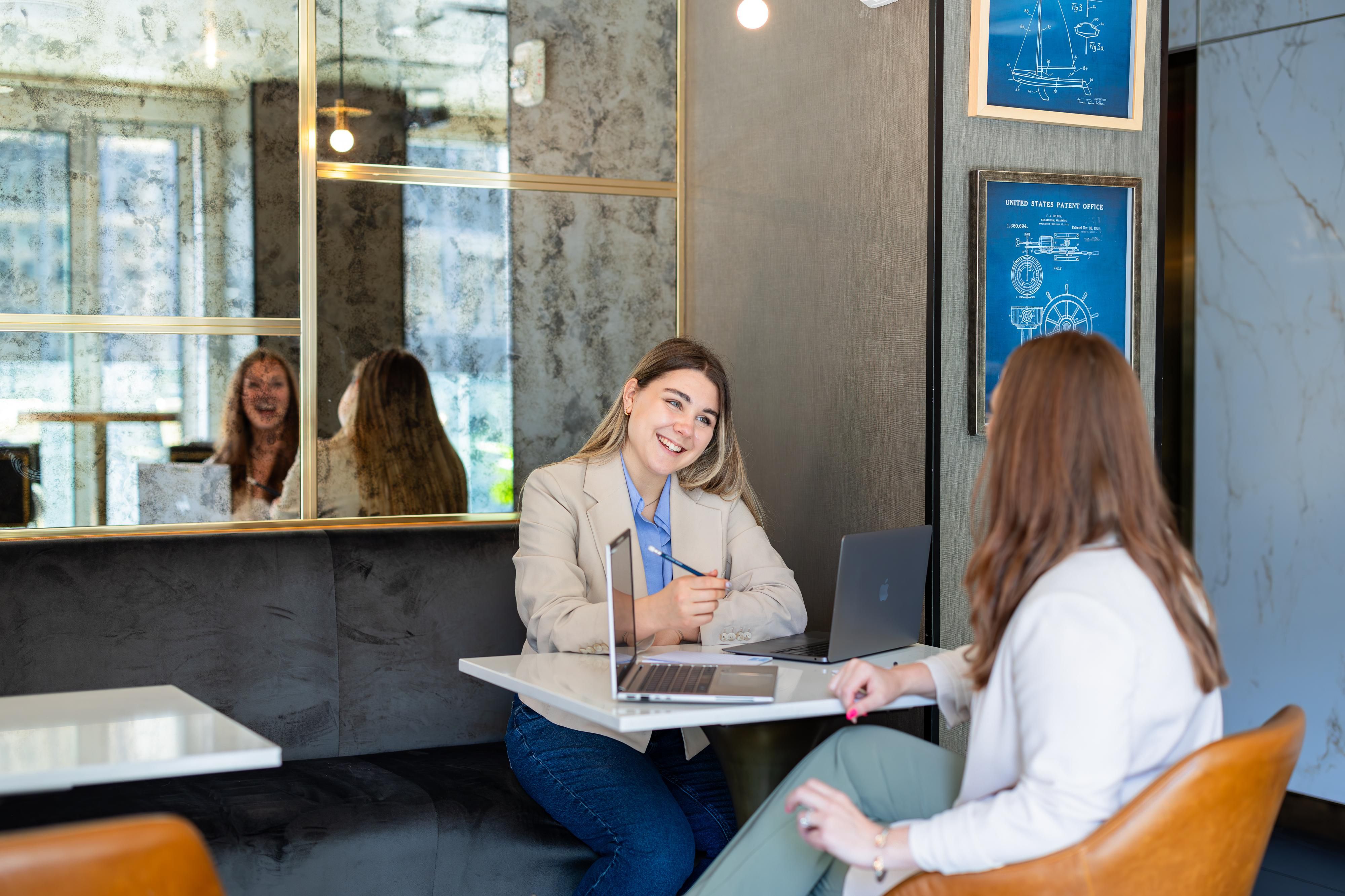 Guest enjoying conversation in rooftop bar