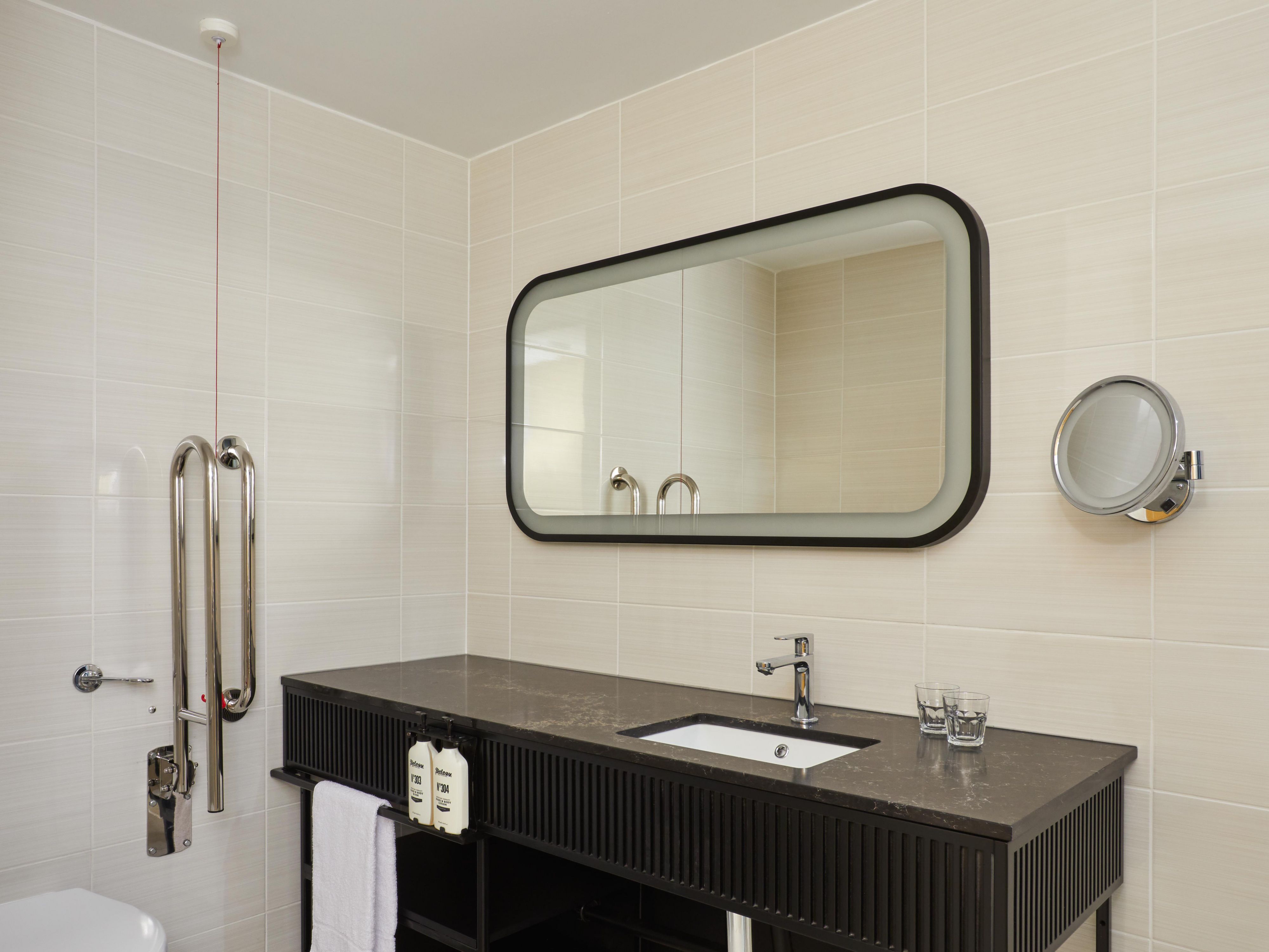 Refurbished Accessible Bathroom with Emergency Cord and Handrails