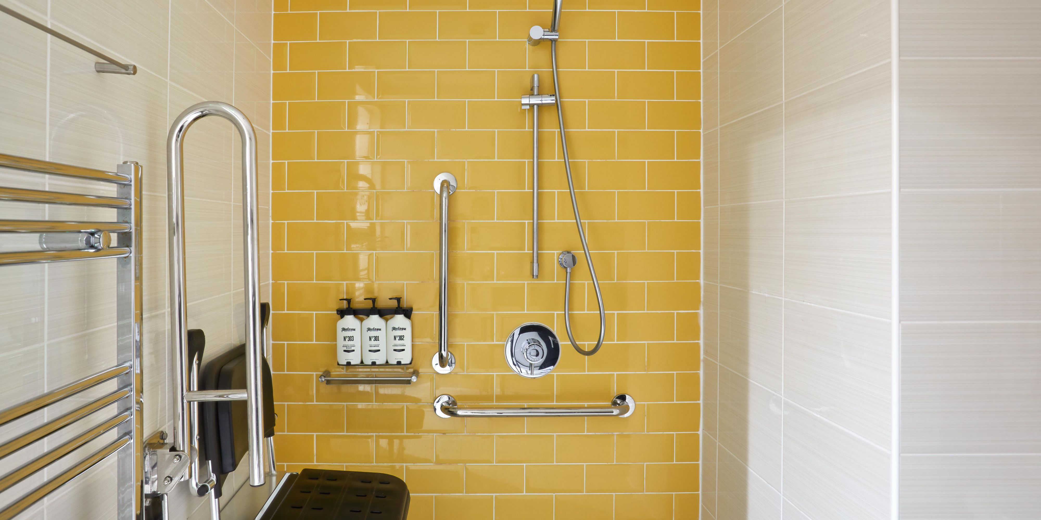 Refurbished Accessible Bathroom with Shower Chair and Handrails