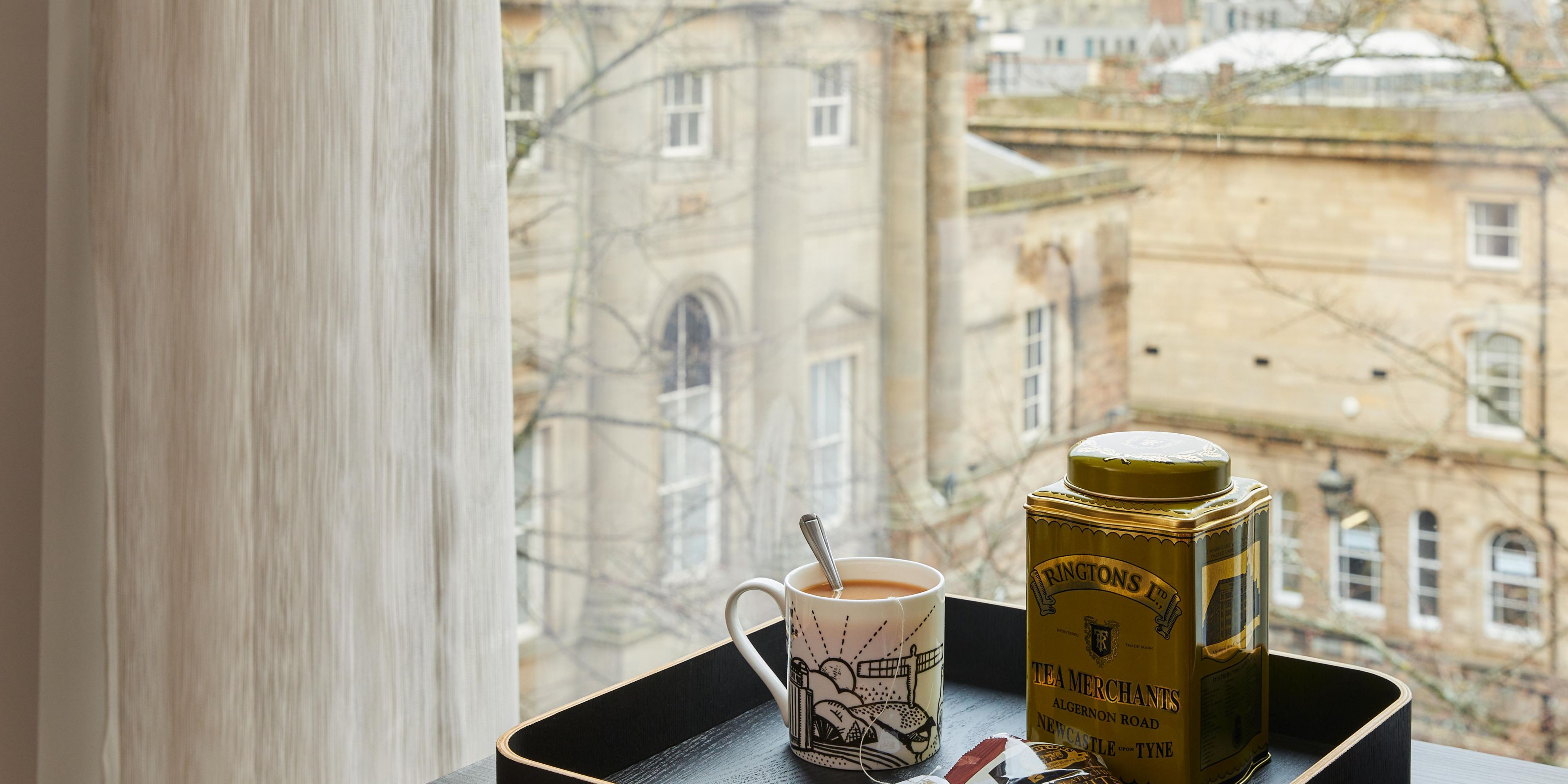 'For the Love of the North' mugs and Ringtons' tea and biscuits