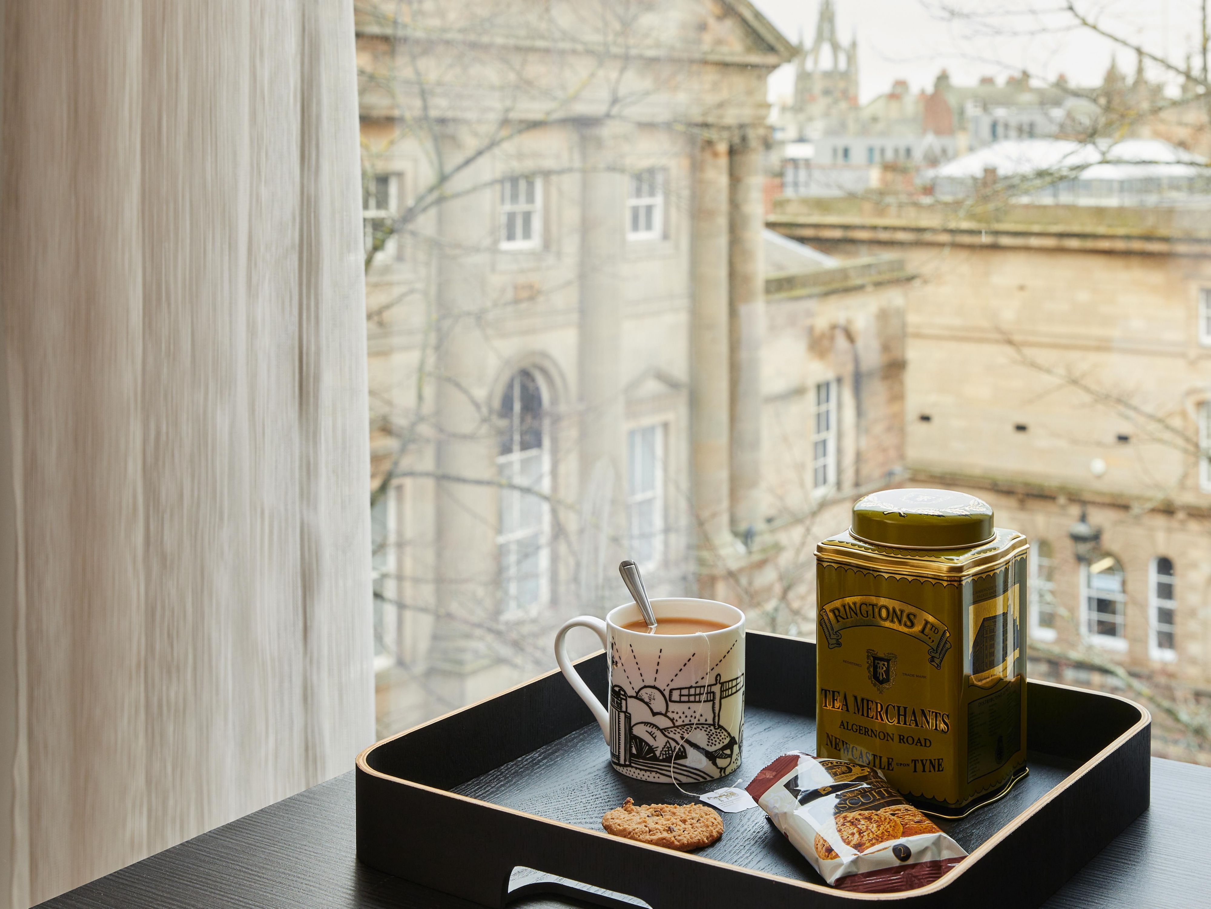 'For the Love of the North' mugs and Ringtons' tea and biscuits