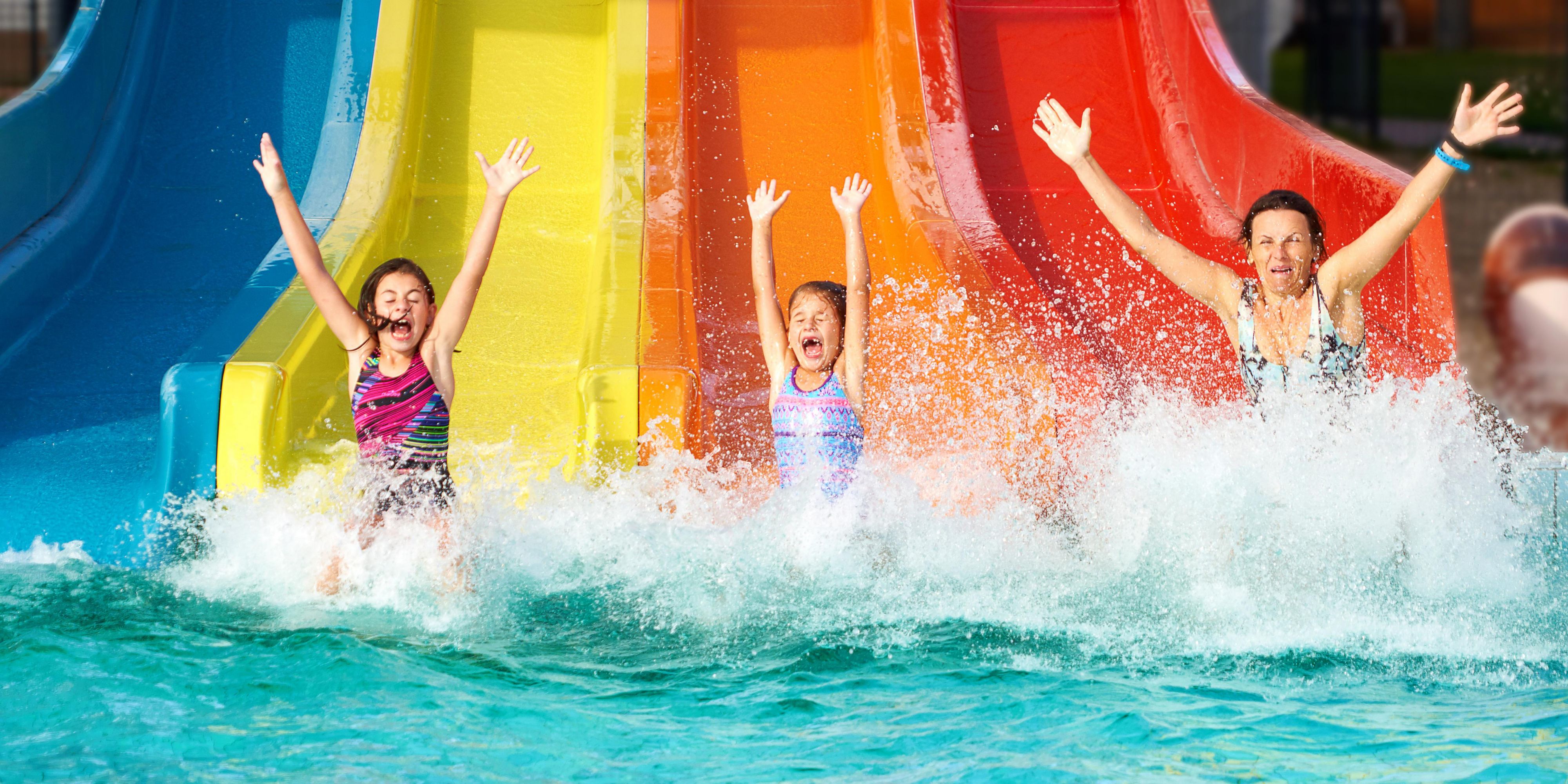 Kids going down a slide at Kahuna Laguna Indoor Water Park.