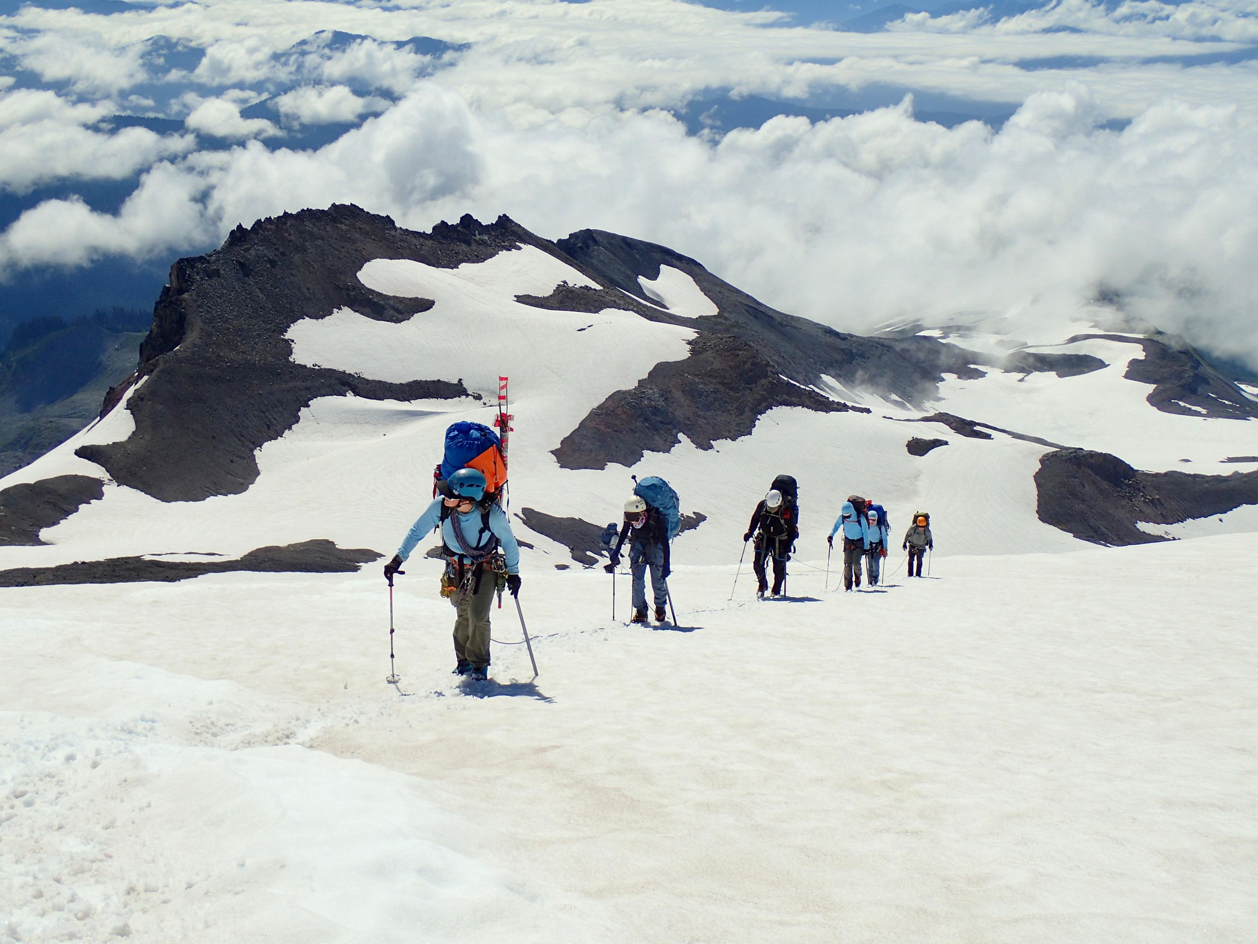 Hikers in the snowy White Mountains.