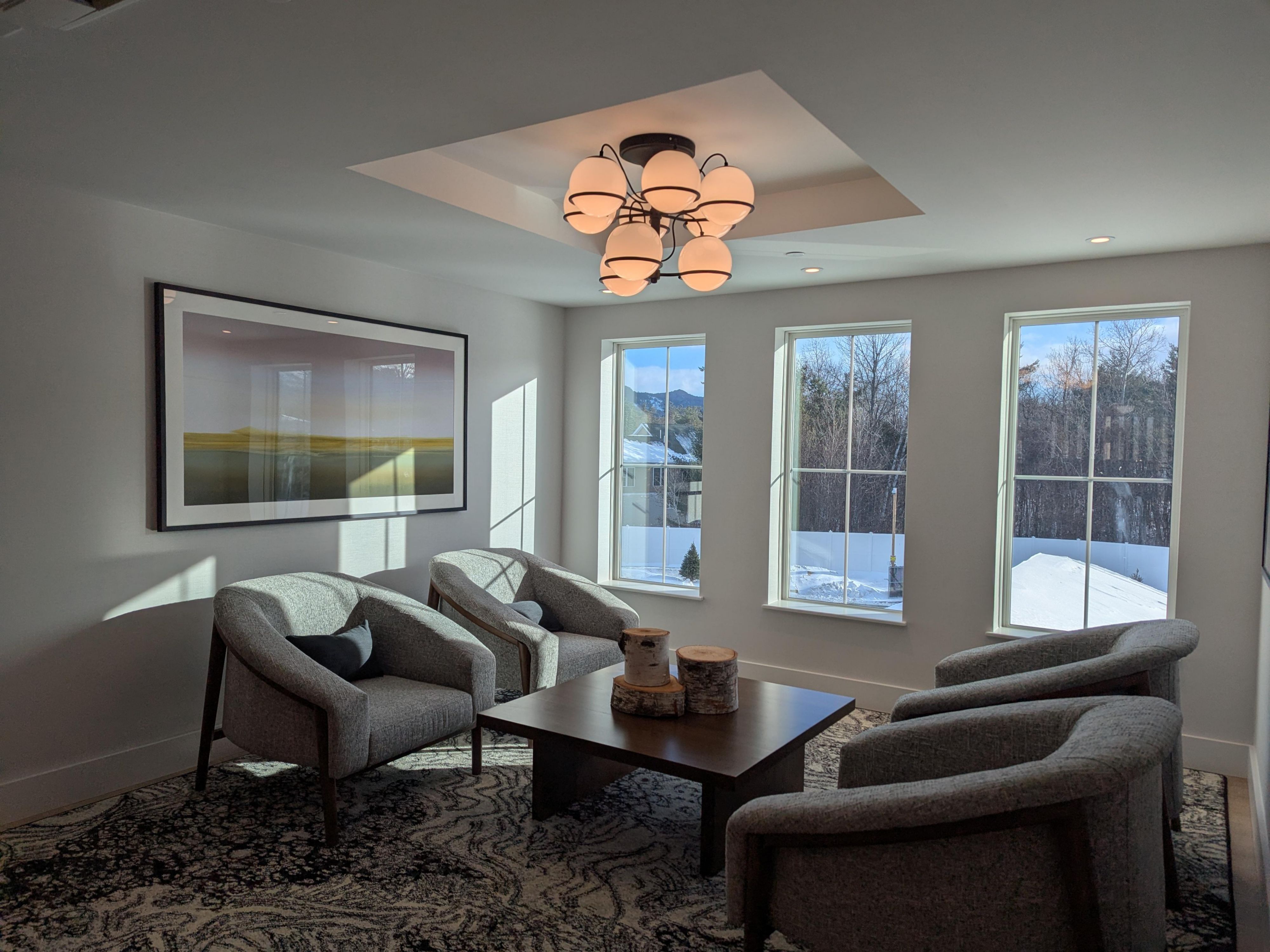 A tucked-away landing with cozy seating and mountain views