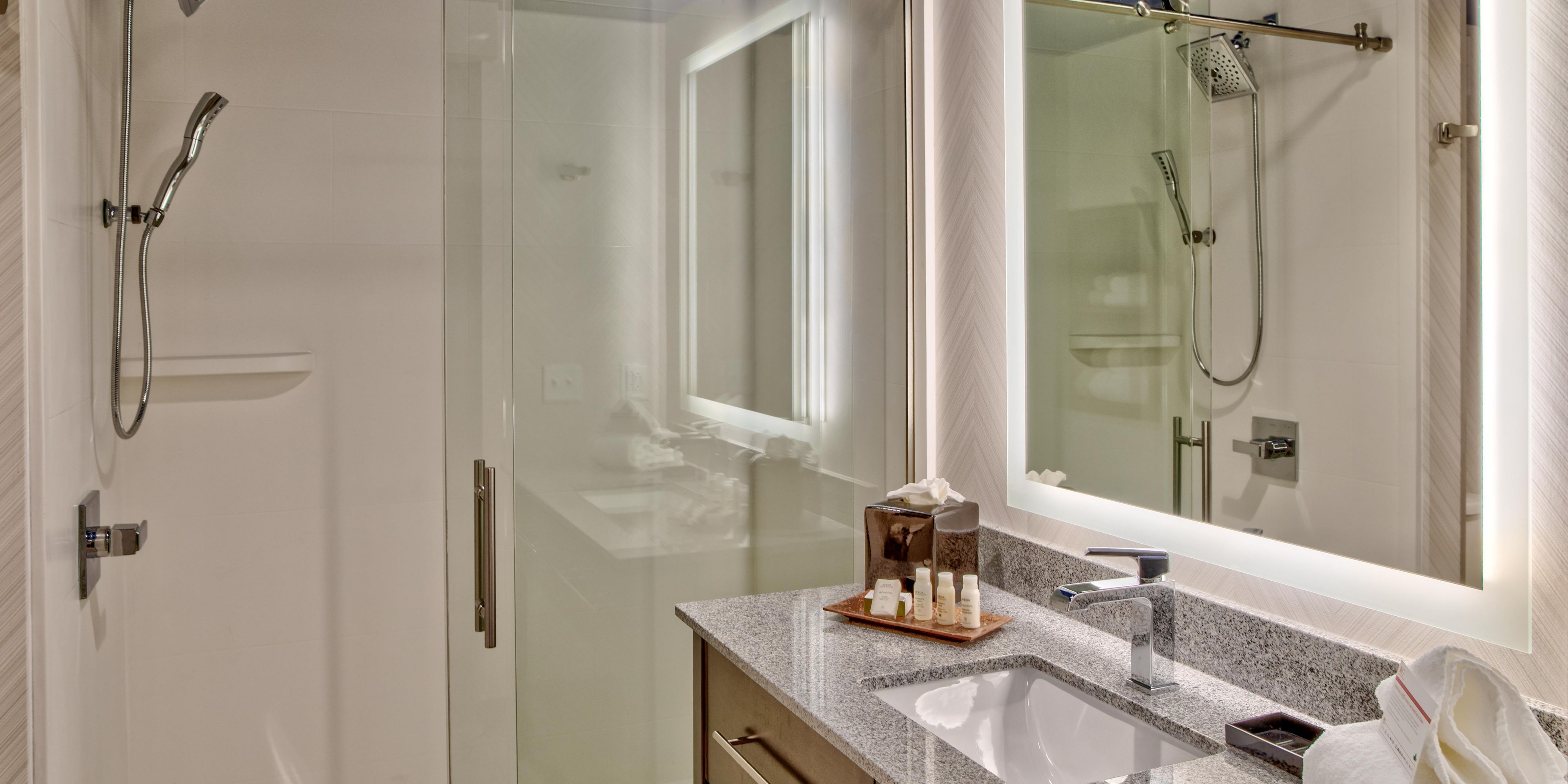 Spacious, marble-finished bathroom with shower