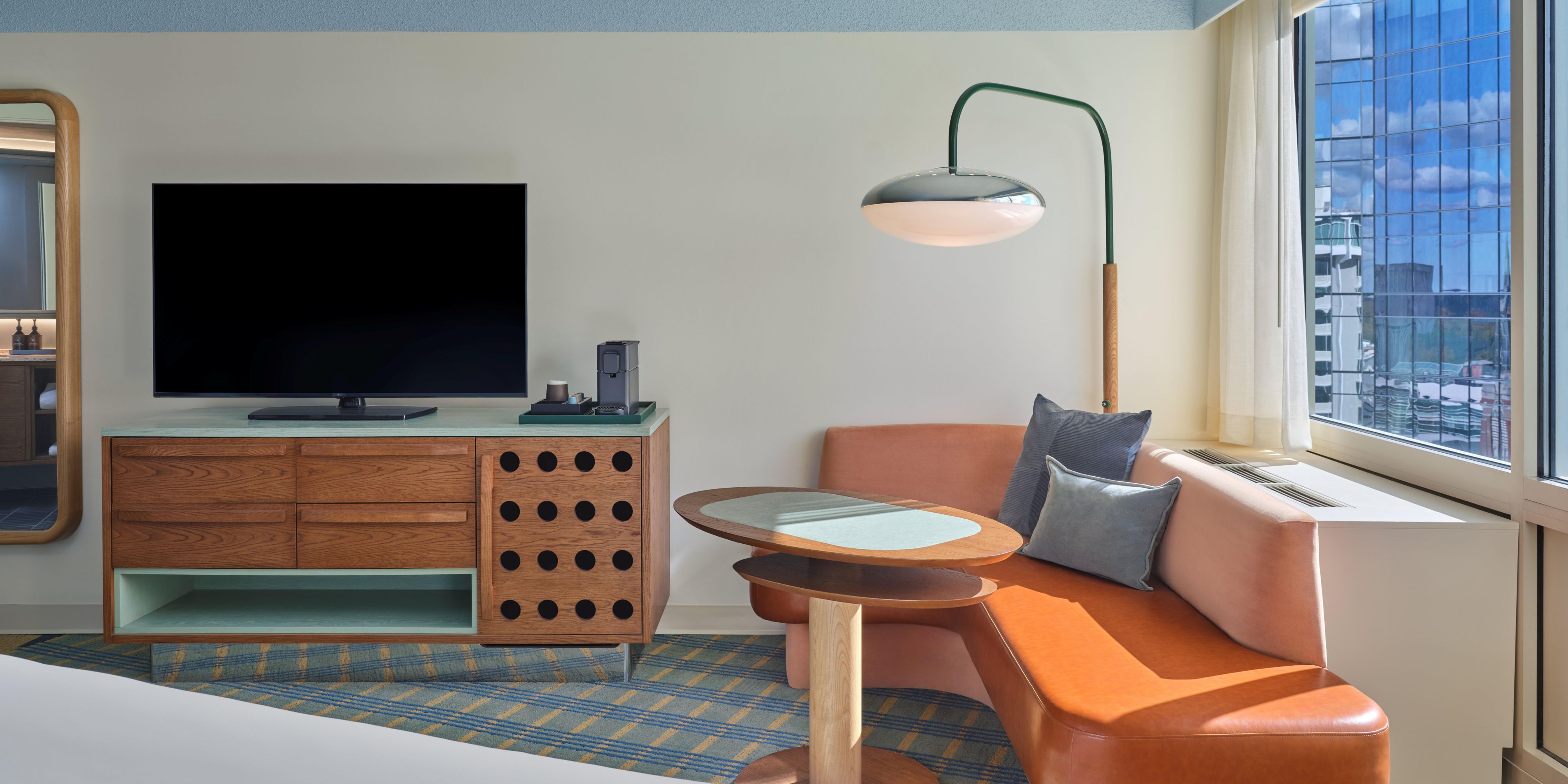 Inviting Guest Room with Lounge Seating and Skyline Views