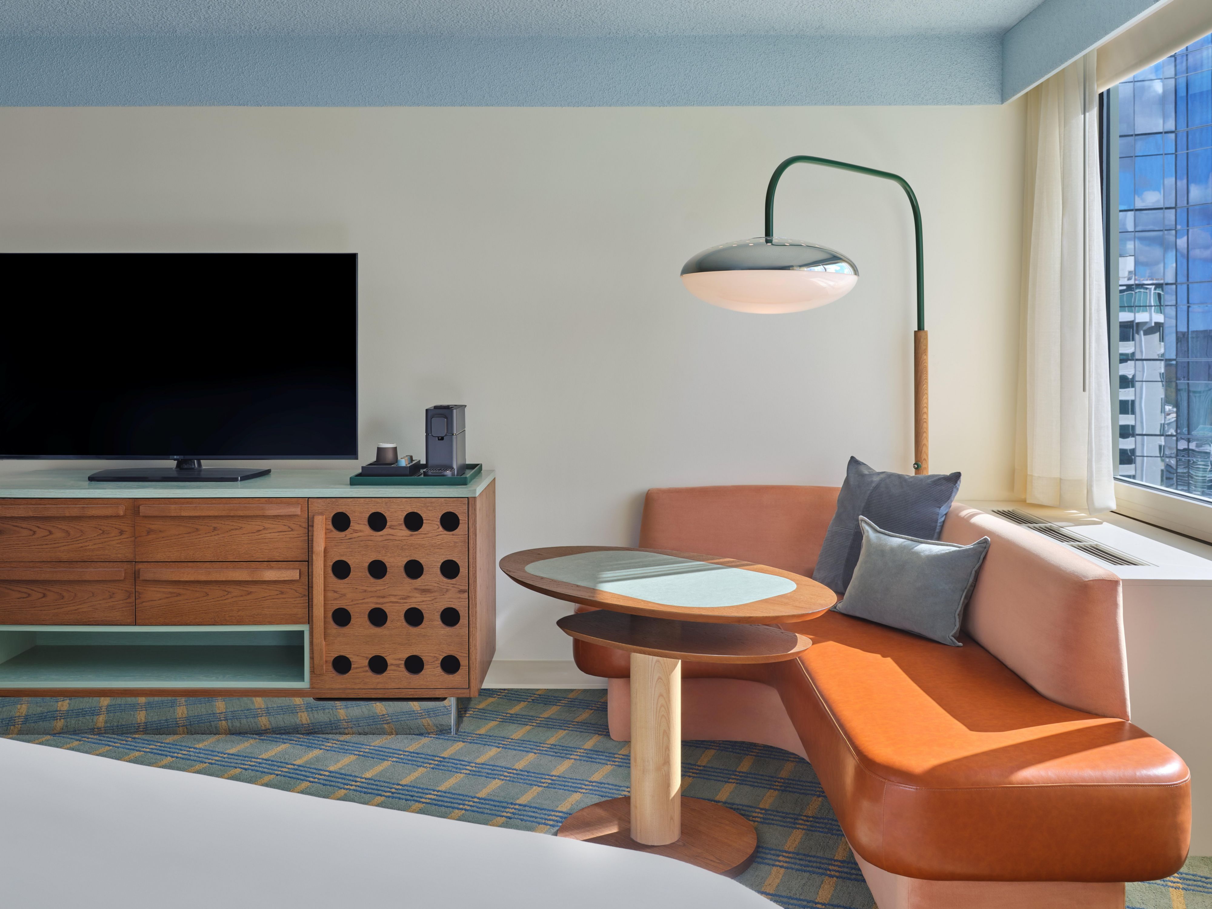 Inviting Guest Room with Lounge Seating and Skyline Views