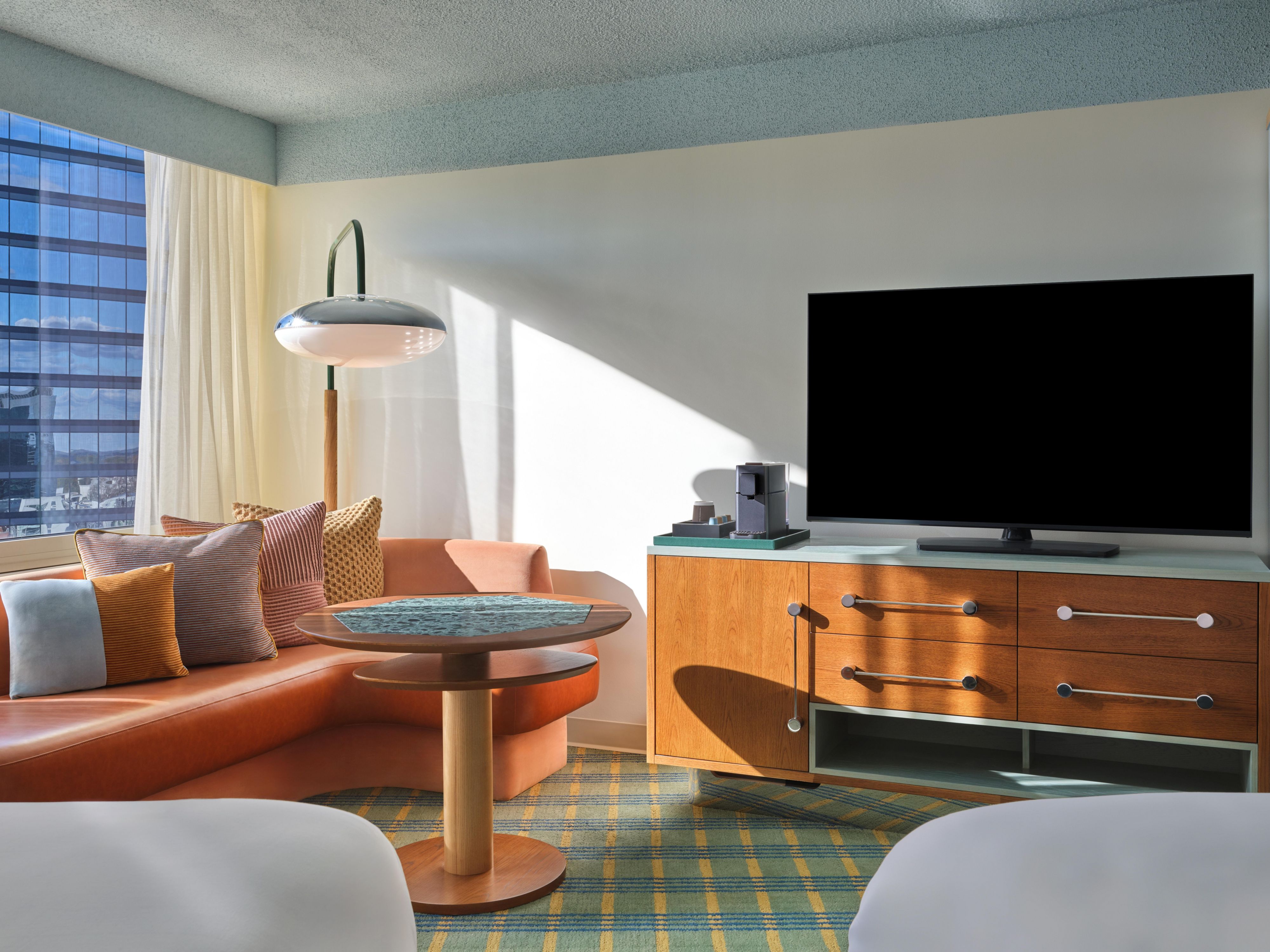 Premium Guest Room Seating Area with City Skyline Views