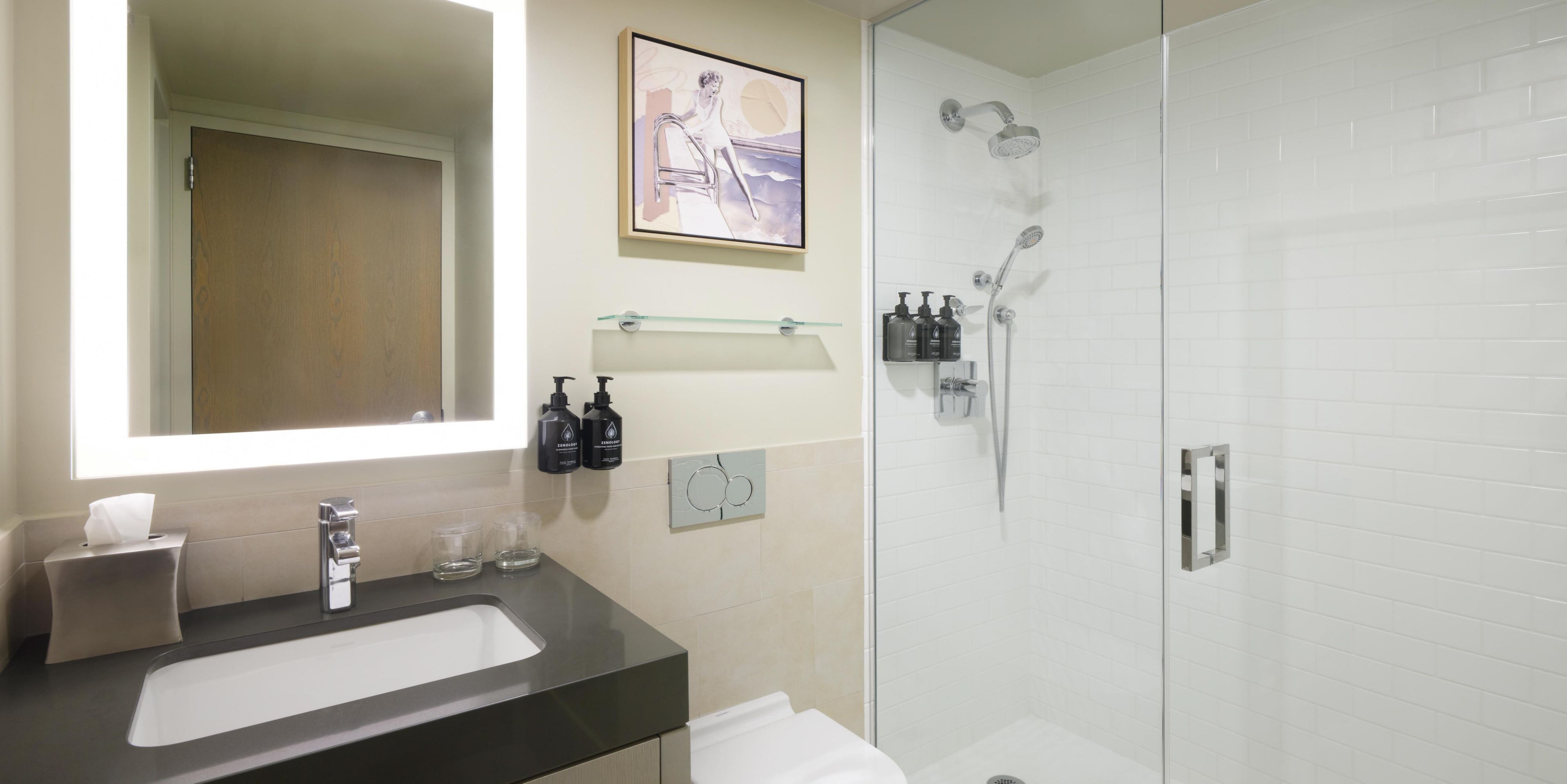 Our modern bathrooms features a walk-in shower and modern sink.