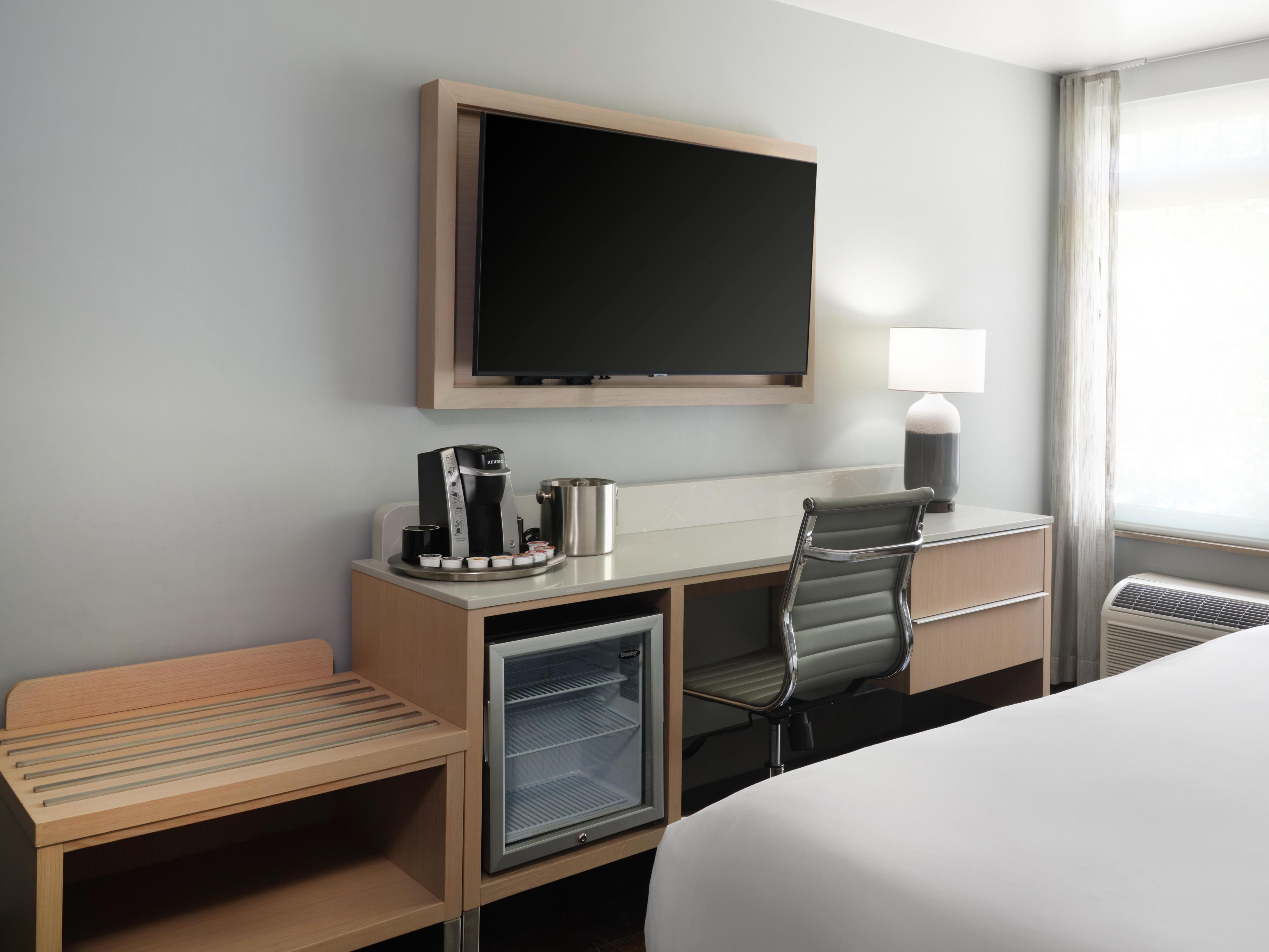 Our king standard room includes a desk and wall-mounted TV.