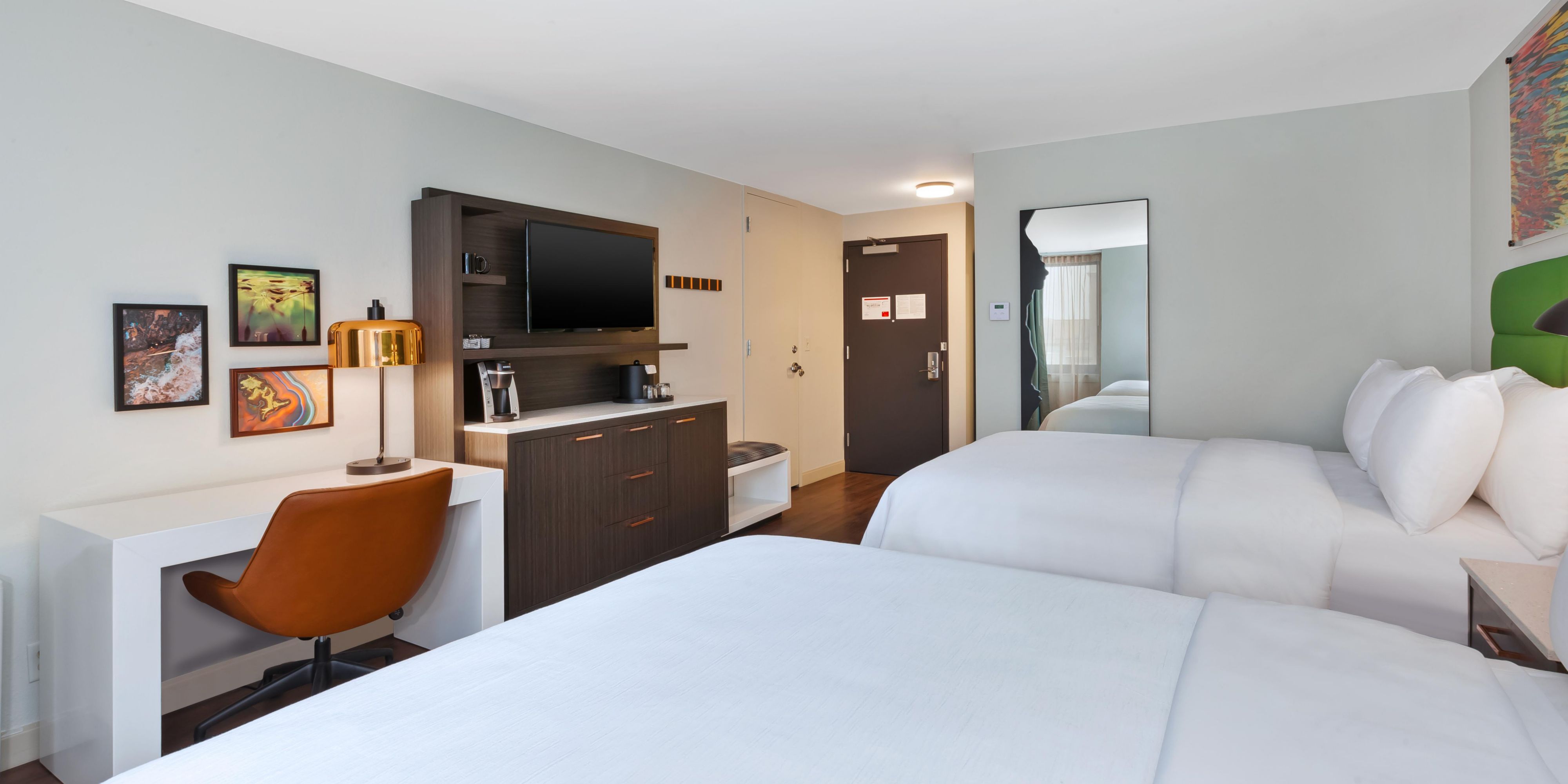 Plush bedding and workspace blends relaxation and productivity.