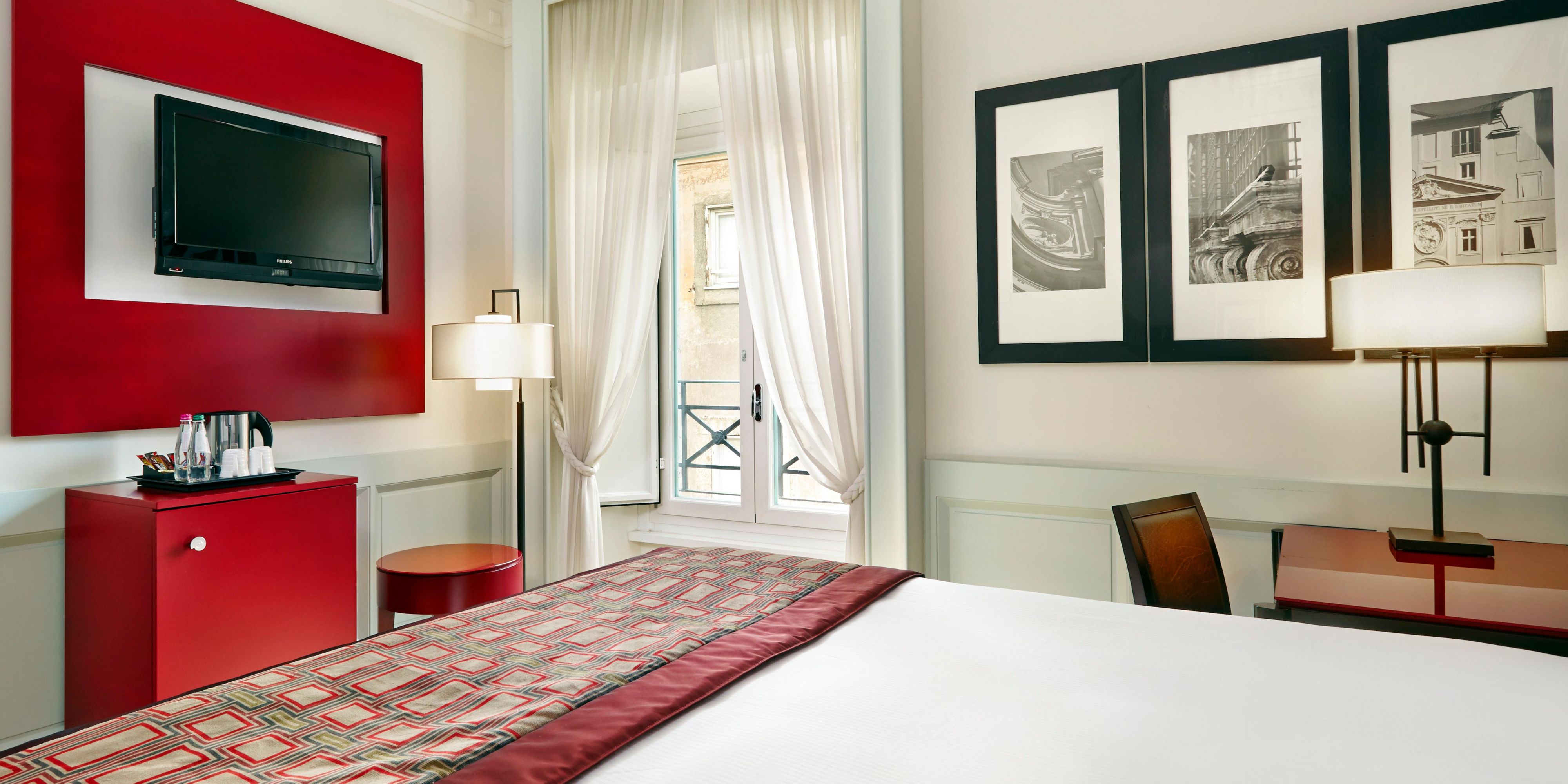 Standard Rooms are decorated with warm colors and wooden floor
