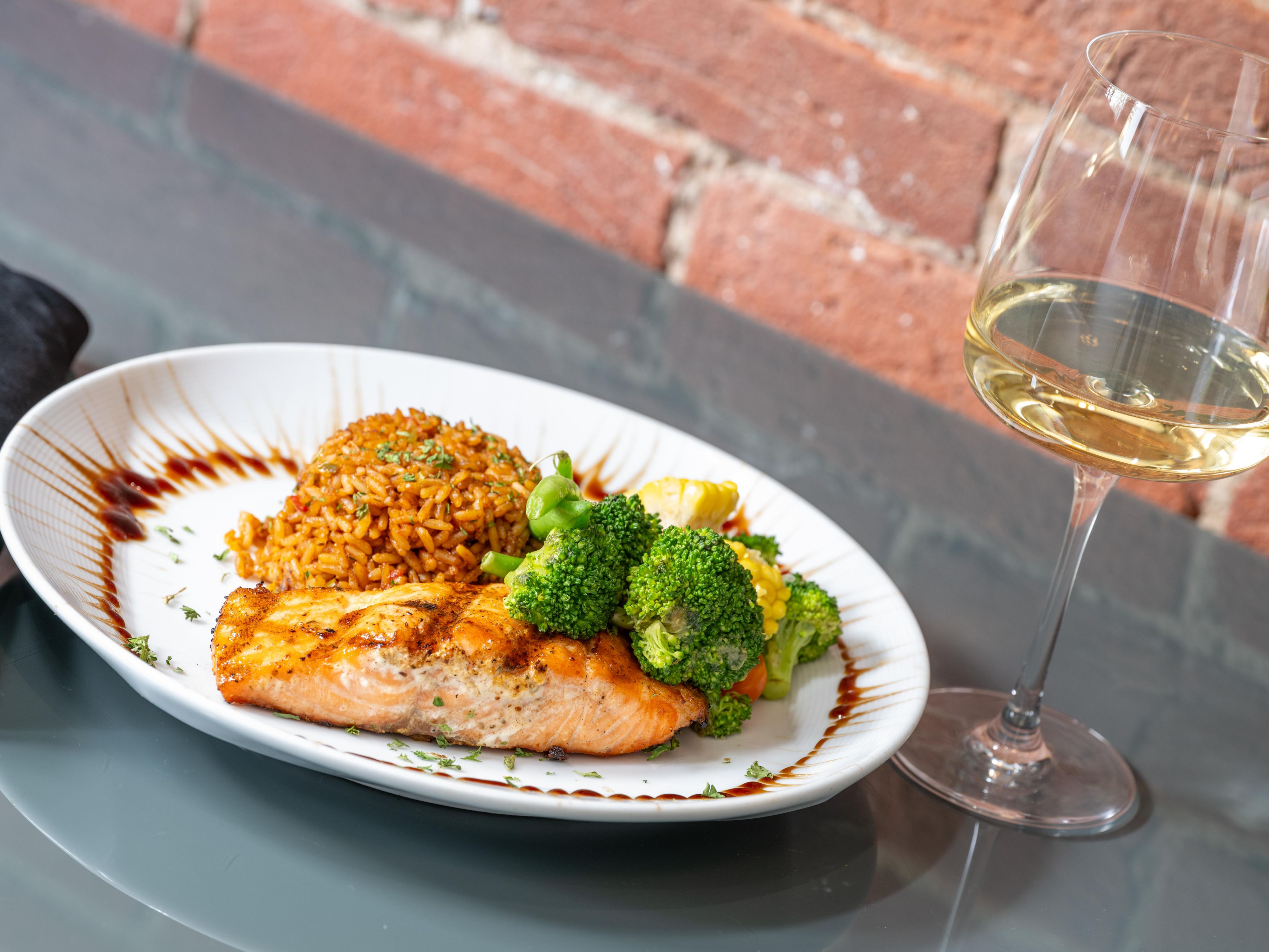 Enjoy salmon with rice and vegetables at Five Oaks.