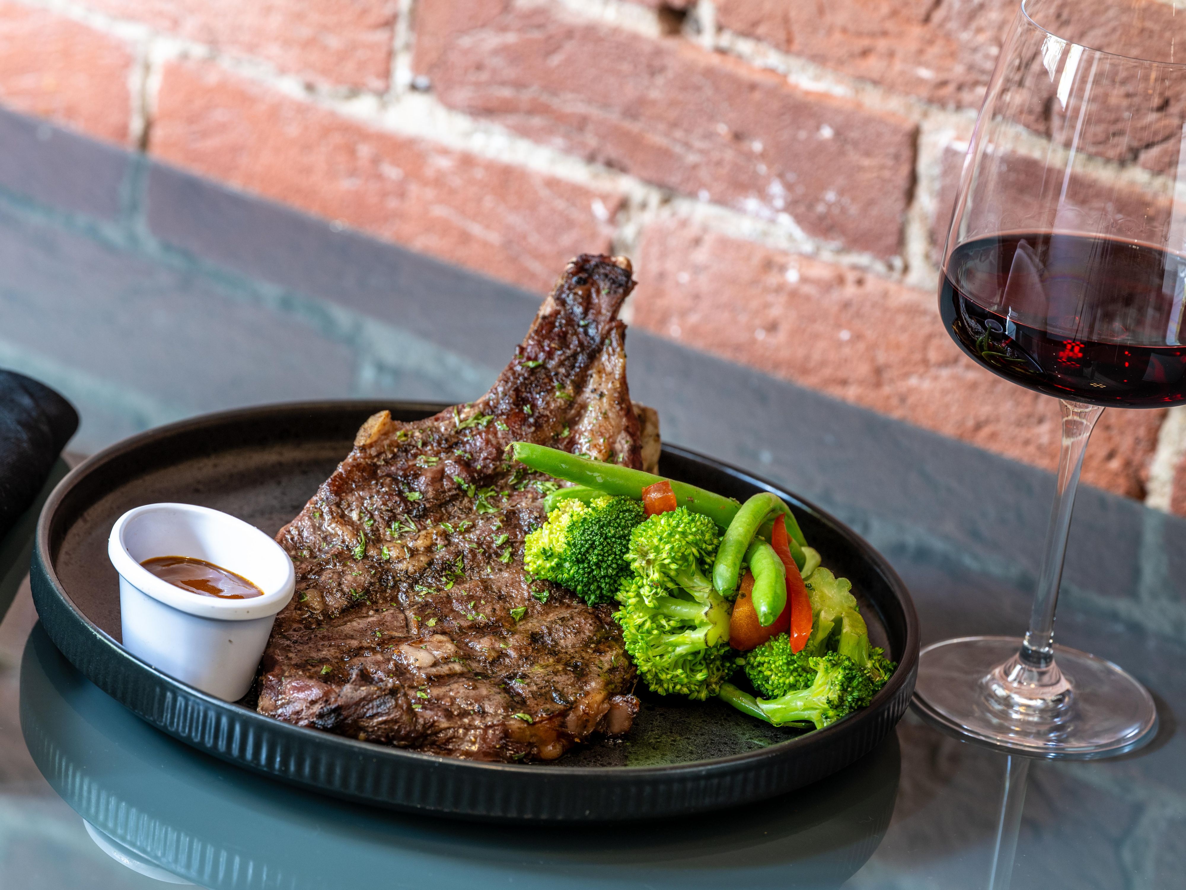 Savor a rib eye steak at Five Oaks.