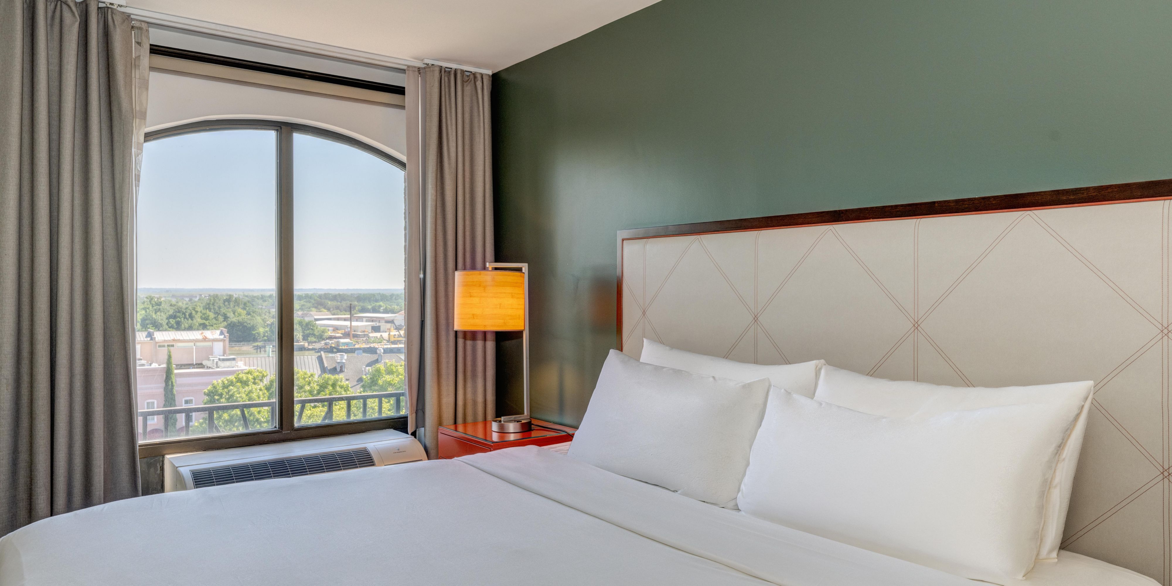 Wake up to sweeping views of Savannah from your high-floor room.