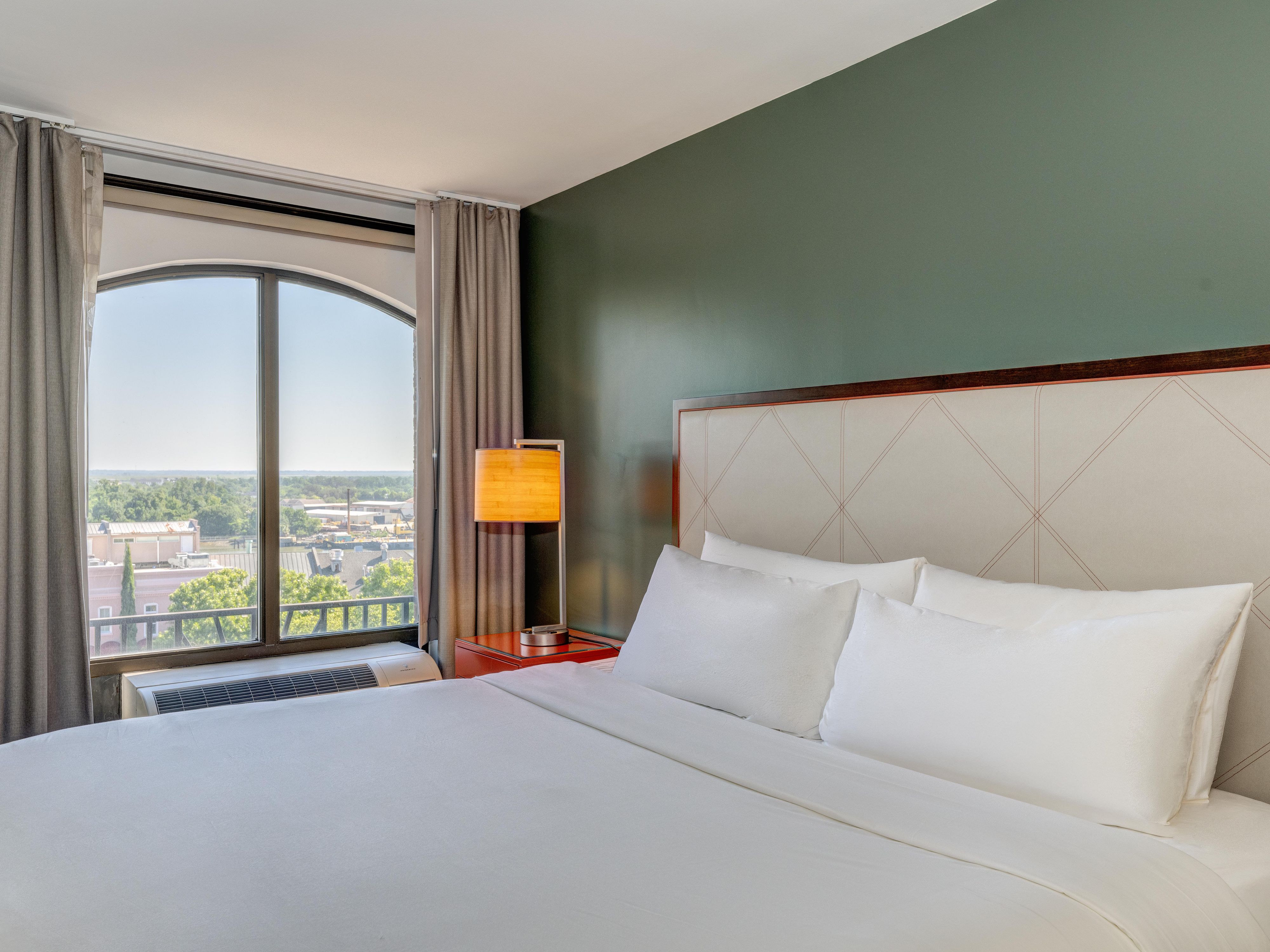 Wake up to sweeping views of Savannah from your high-floor room.